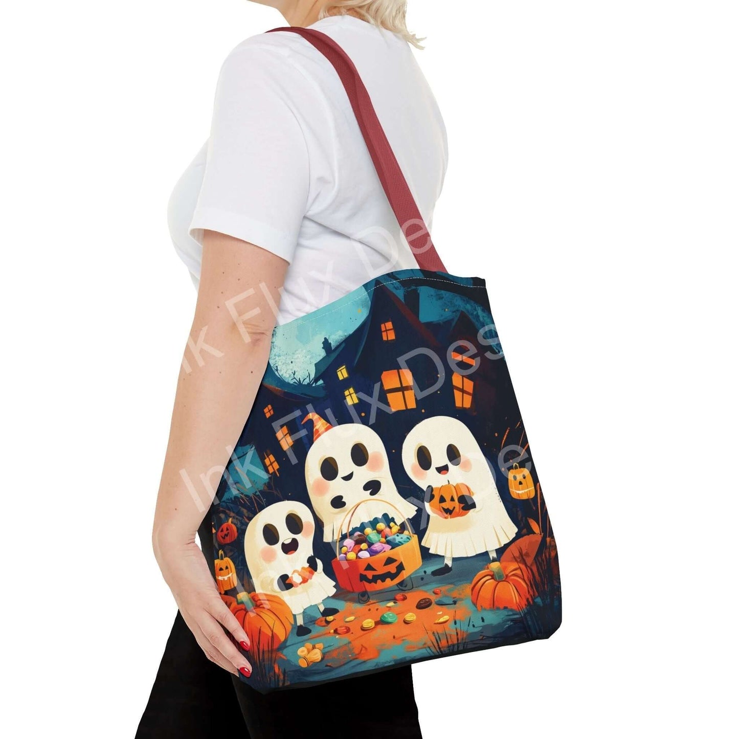 Woman carrying a Little Ghost Tote Bag with all-over print of cute ghosts and pumpkins, ideal for Halloween accessories