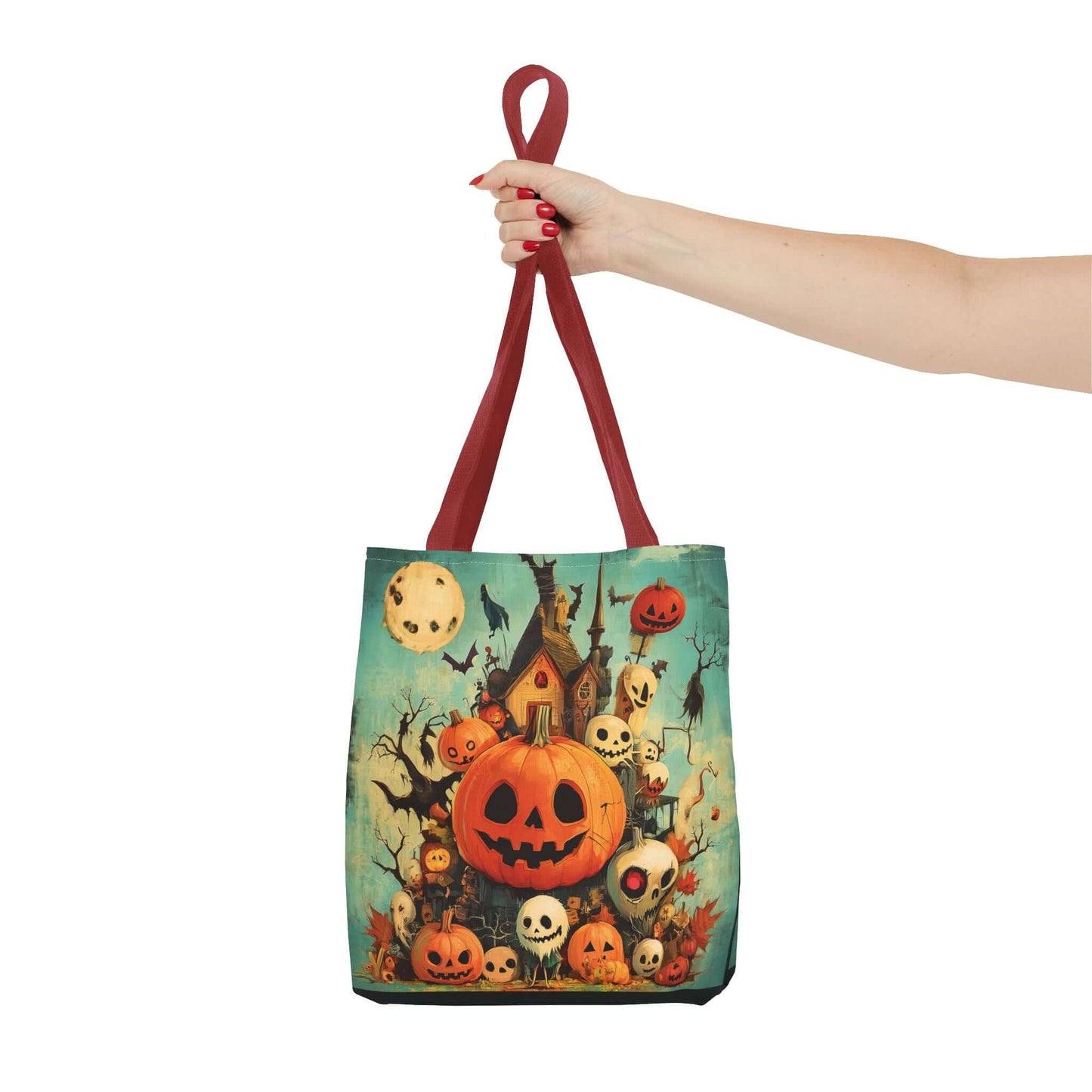 Stylish tote bag featuring a vibrant all-over print of jack-o-lanterns on a porch, held by a hand with red nails, perfect for Halloween.