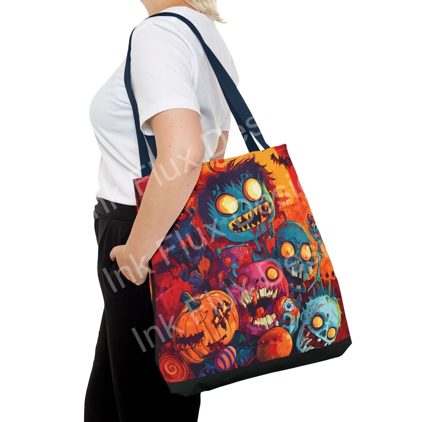 Woman carrying a vibrant Little Zombies all-over print tote bag, featuring colorful Halloween-themed graphics and blue straps.