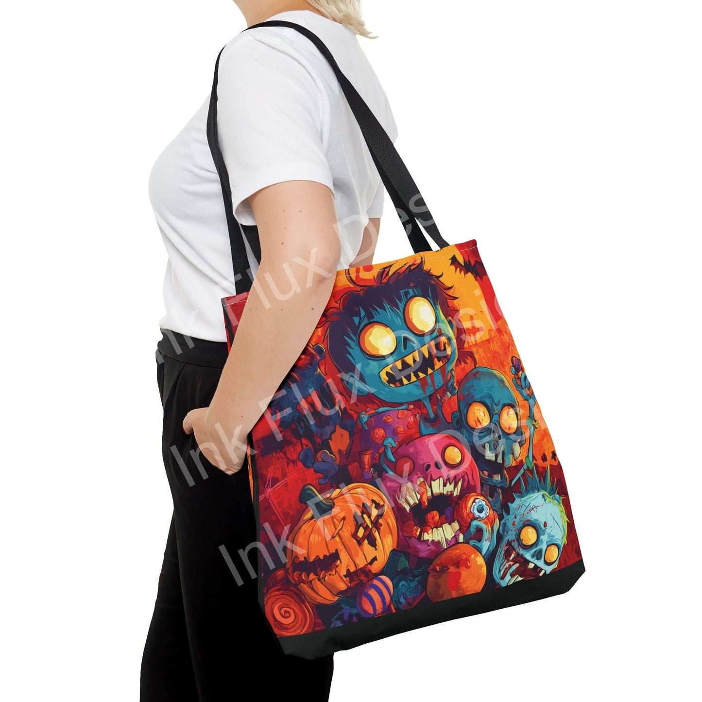 Woman carrying a Little Zombies Tote Bag, featuring vibrant all-over print design, available in multiple sizes and handle colors.