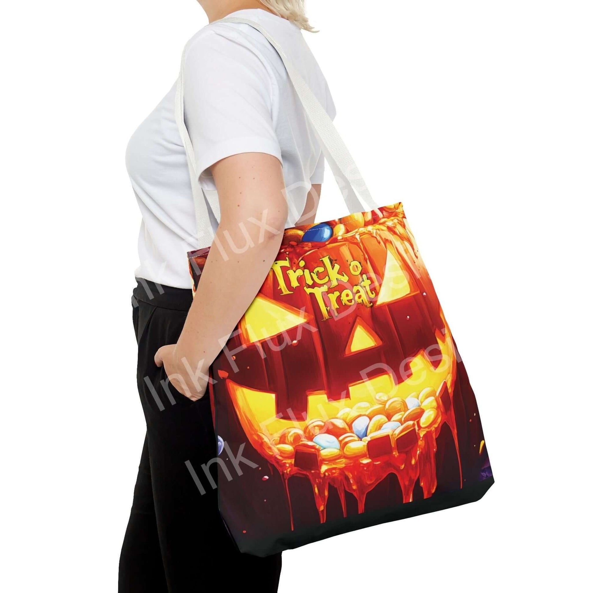 Woman carrying a vibrant Jack o Lantern II Tote Bag with "Trick or Treat" text, showcasing high-end all-over print and durable design.