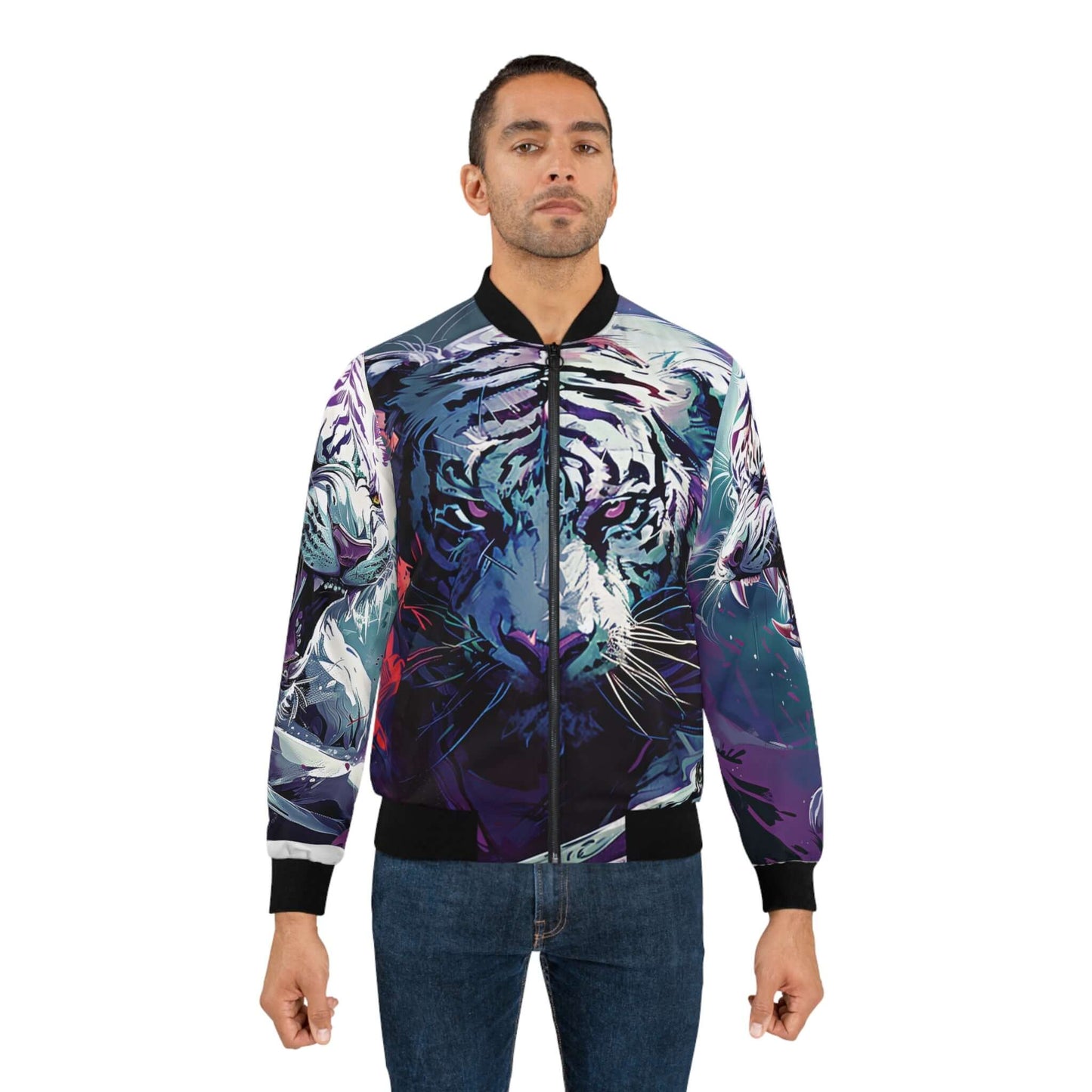 A man dons the Raging White Tiger Men's Bomber Jacket (AOP), featuring an artistic depiction of a tiger head. Complementing his modern style, he pairs it with blue jeans against a plain white background, capturing the essence of contemporary men's fashion.