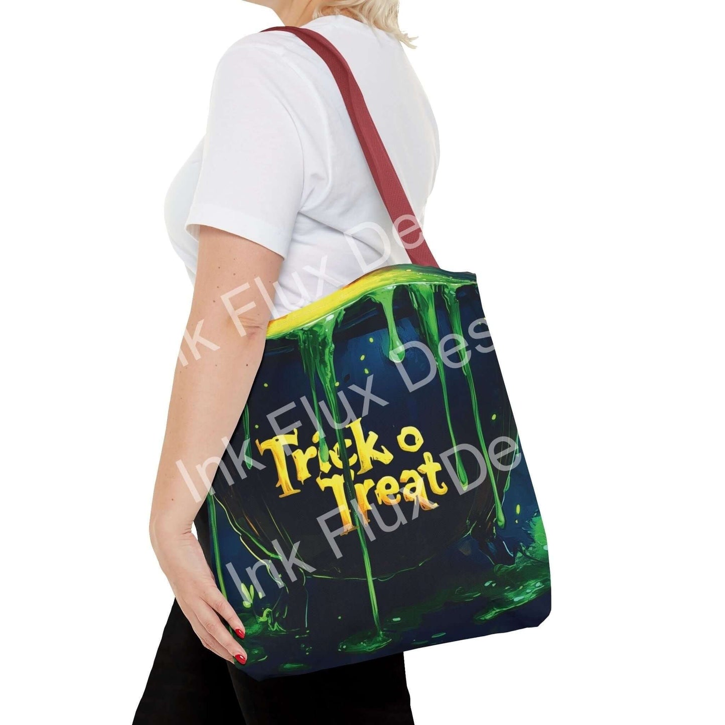 Woman carrying a vibrant witch cauldron-themed tote bag, featuring "Trick or Treat" design with green and yellow accents.