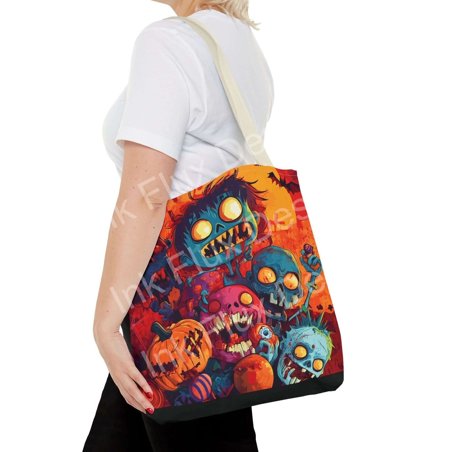 Woman carrying a colorful Little Zombies tote bag featuring vibrant all-over print design with cartoon-style zombie and pumpkin graphics.