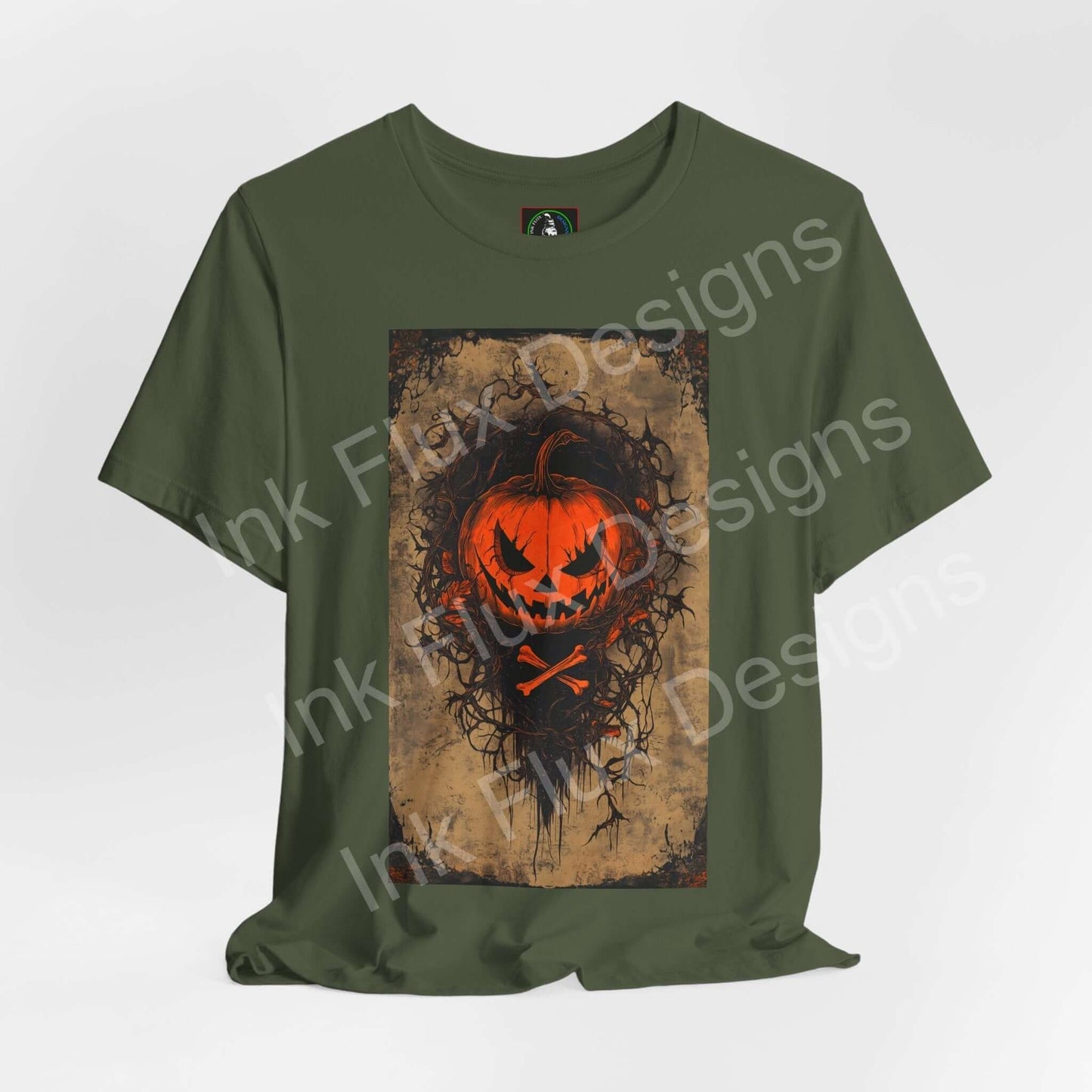 jack-o-lantern t-shirt featuring a bold pumpkin design on a green unisex tee by Ink Flux Designs.