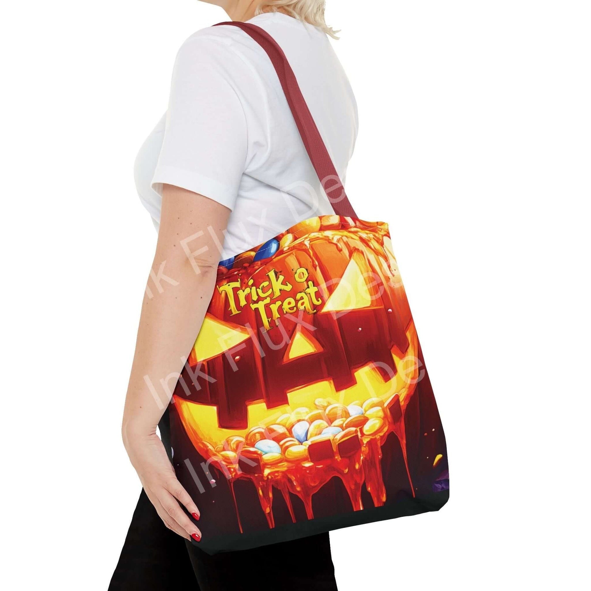 Woman carrying a Jack o Lantern II tote bag, featuring vibrant all-over print and red handles, perfect for Halloween.