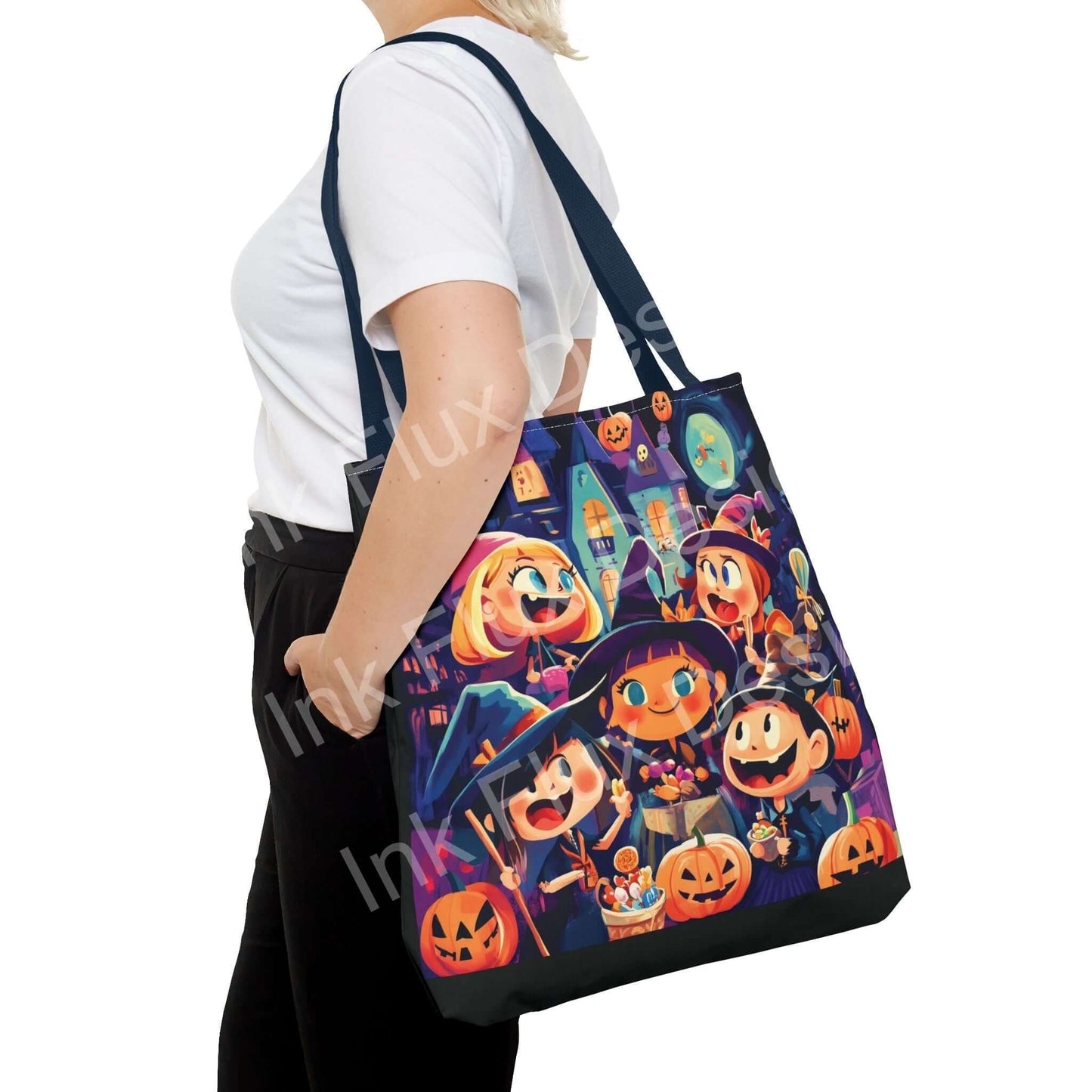 Woman carrying a Little Witches all-over print tote bag showcasing vibrant Halloween-themed designs and blue handles.