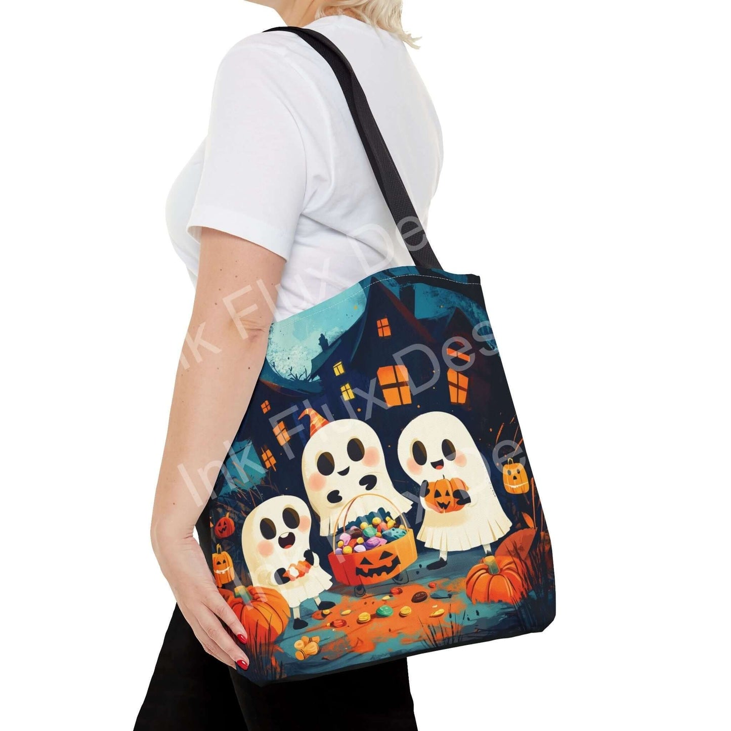 Woman carrying a Little Ghost Tote Bag featuring cute ghost designs, full of Halloween candy, with durable straps and colorful detailing.