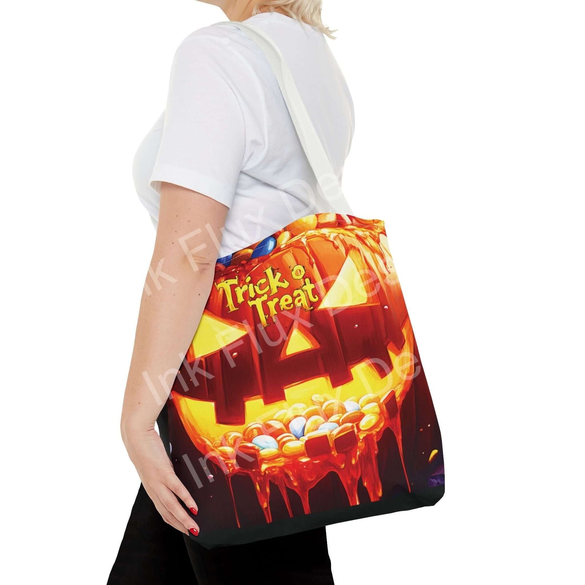 Woman carrying a Jack o Lantern II tote bag with vibrant Trick or Treat design, showcasing double-stitched seams and cotton webbing straps.
