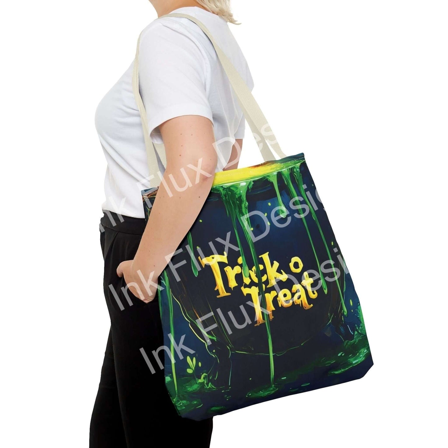 Woman carrying a witch cauldron-themed tote bag with "Trick or Treat" design, featuring green and black colors with yellow handles.