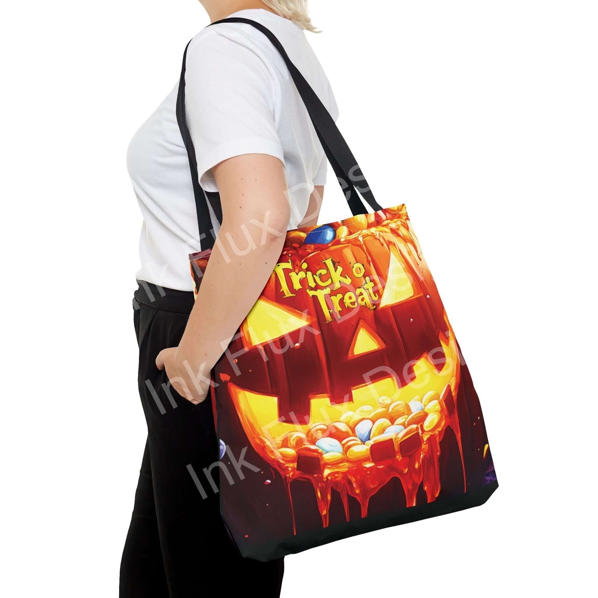 Woman carrying a vibrant Jack o Lantern II themed tote bag with "Trick or Treat" design, showcasing its all-over print and cotton webbing straps.