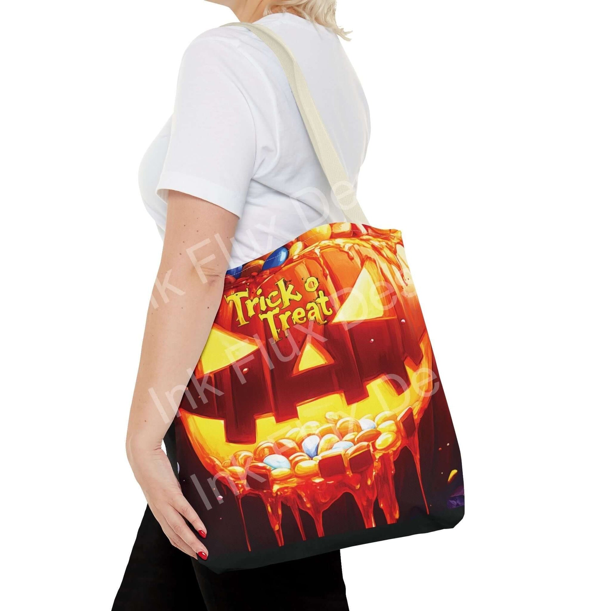 Woman carrying a Jack o Lantern II Tote Bag with vibrant trick or treat design, available in multiple sizes and handle colors
