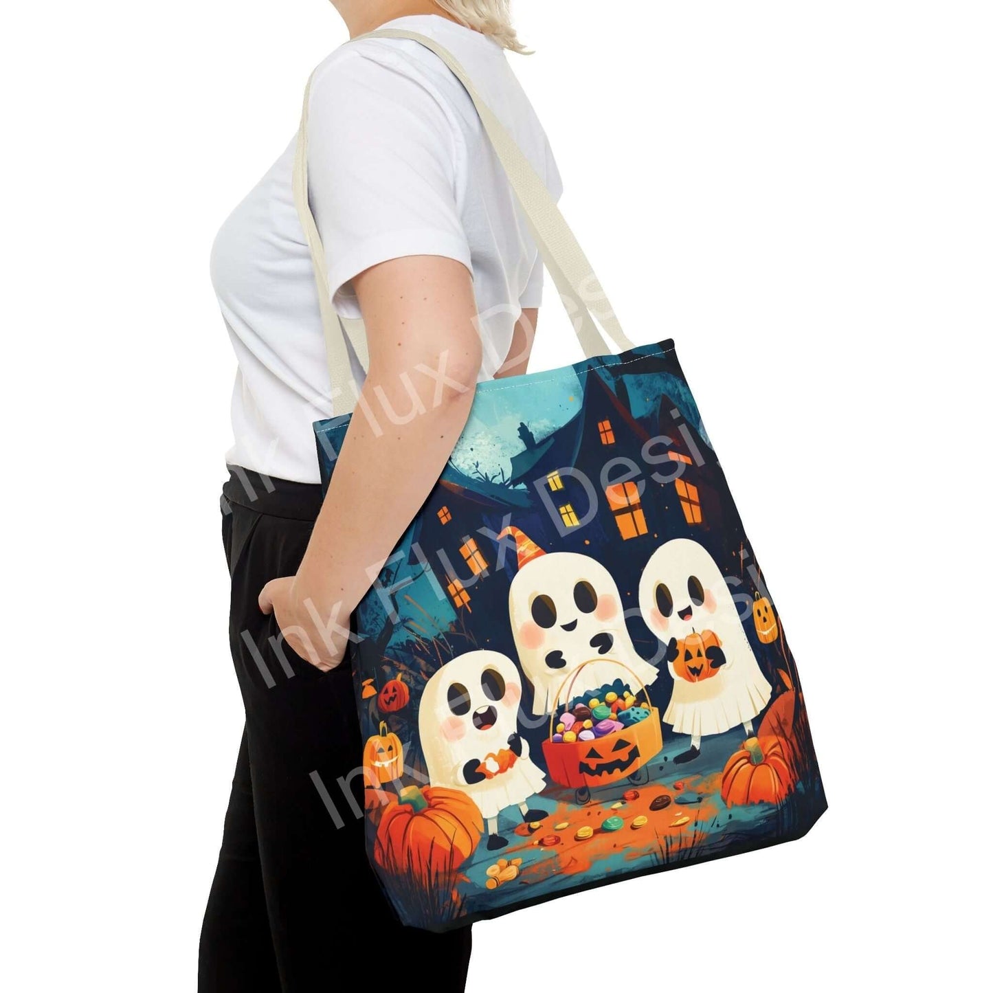 Woman carrying a Little Ghost Tote Bag featuring all-over print of cute ghosts, pumpkins, and a haunted house, with contrasting handles.