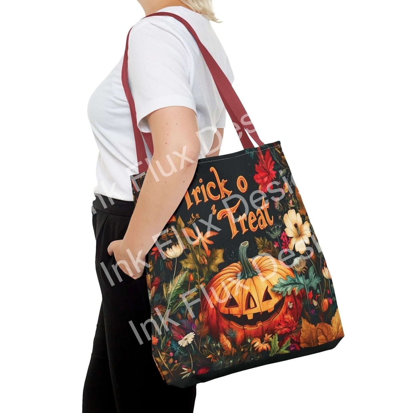 Woman carrying a Jack o Lantern tote bag with vibrant autumn-themed all-over print, featuring red straps.