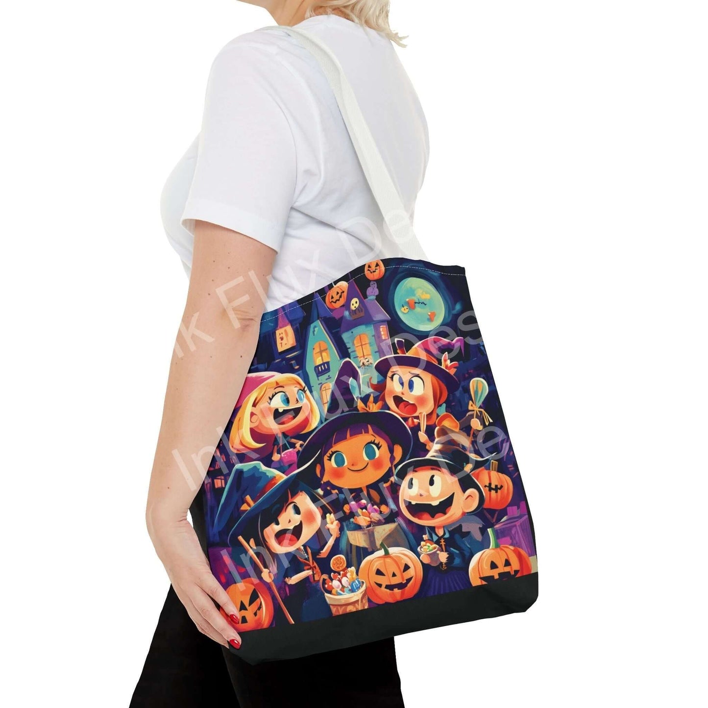 Woman carrying a Little Witches all-over print tote bag featuring cartoon witches and pumpkins, available in multiple sizes and handle colors.