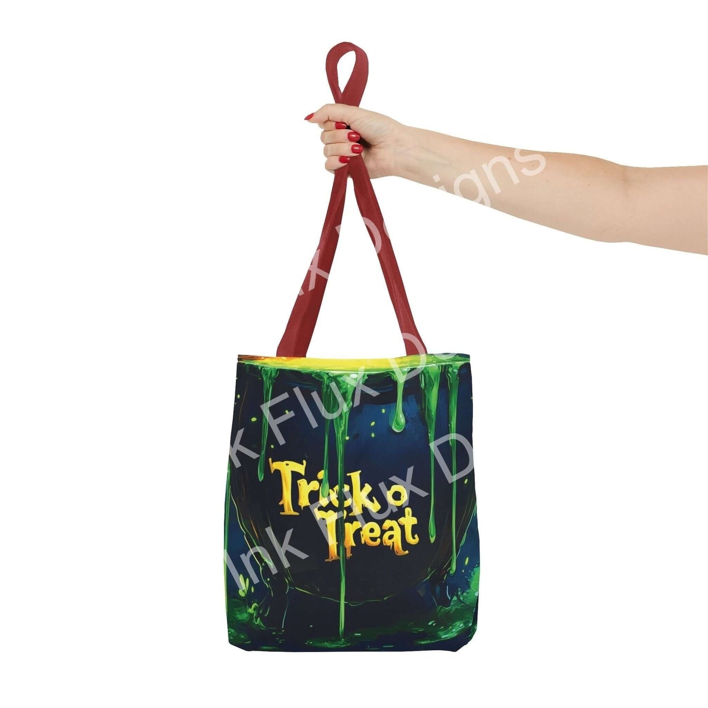 Woman holding a colorful Witch Cauldron Tote Bag with "Trick or Treat" design and red handles, made from durable polyester.