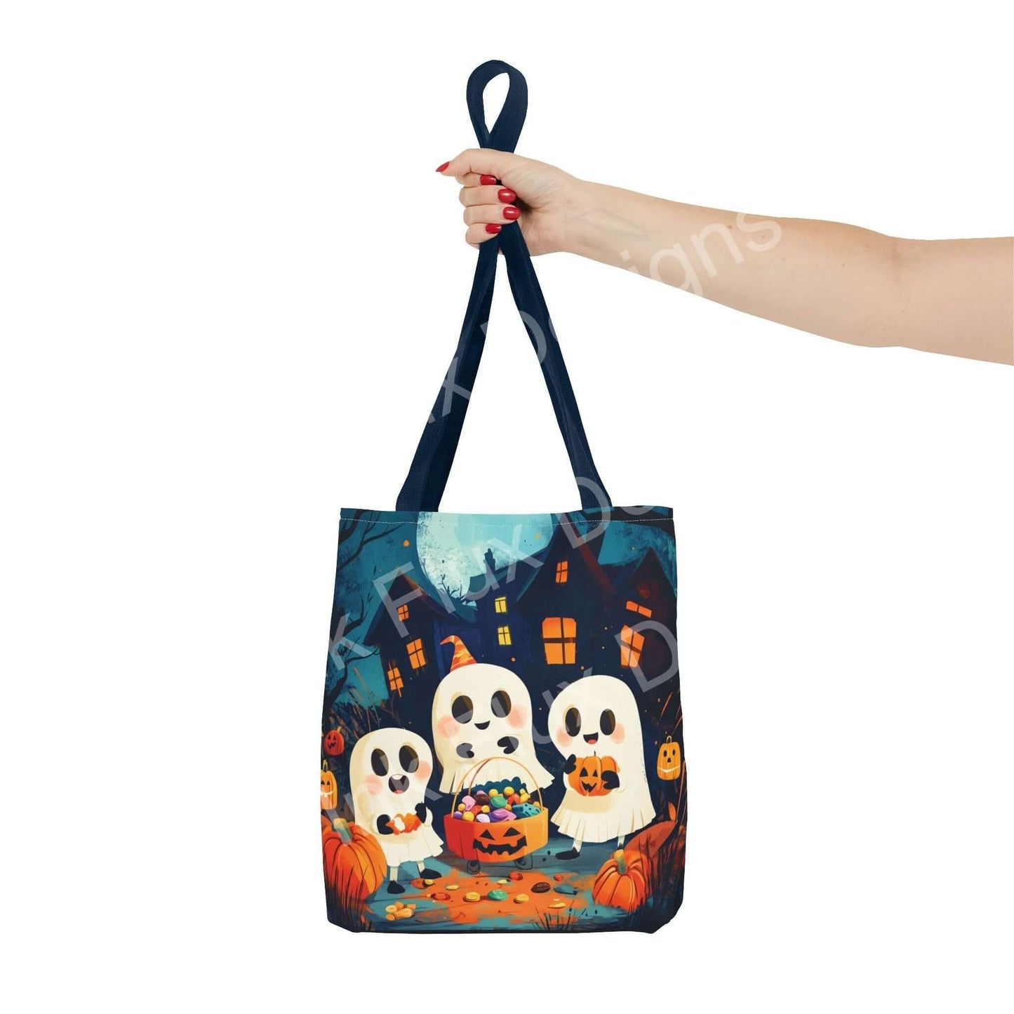 Hand holding a Little Ghost AOP Tote Bag featuring cute ghost and pumpkin design, ideal for Halloween accessories.
