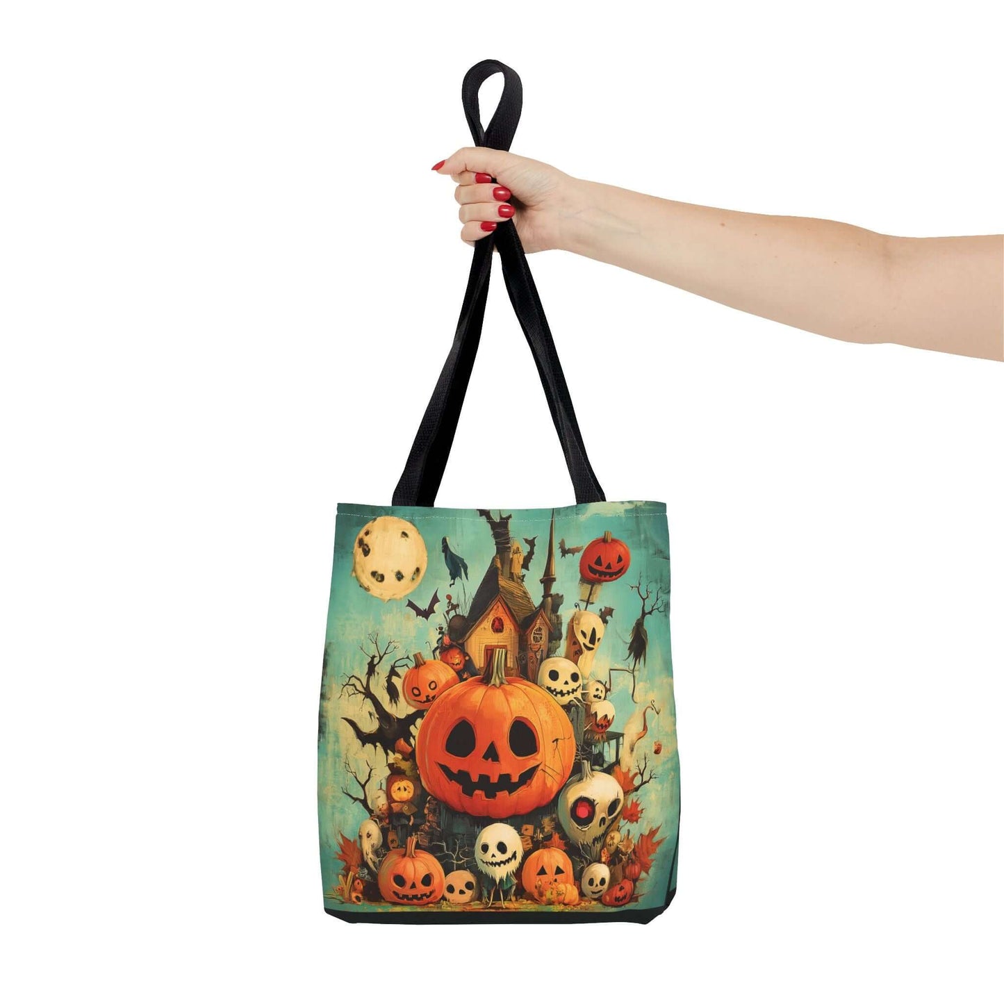Person holding a tote bag featuring a colorful all-over print of Jack o' lanterns and spooky Halloween motifs on a porch, made from durable polyester.