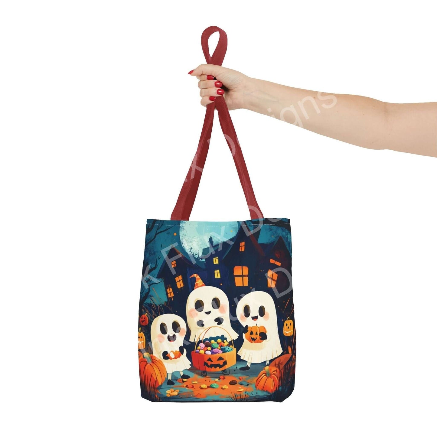 Woman holding a Little Ghost Tote Bag featuring an all-over spooky print with three cute ghosts and pumpkins, ideal for Halloween.