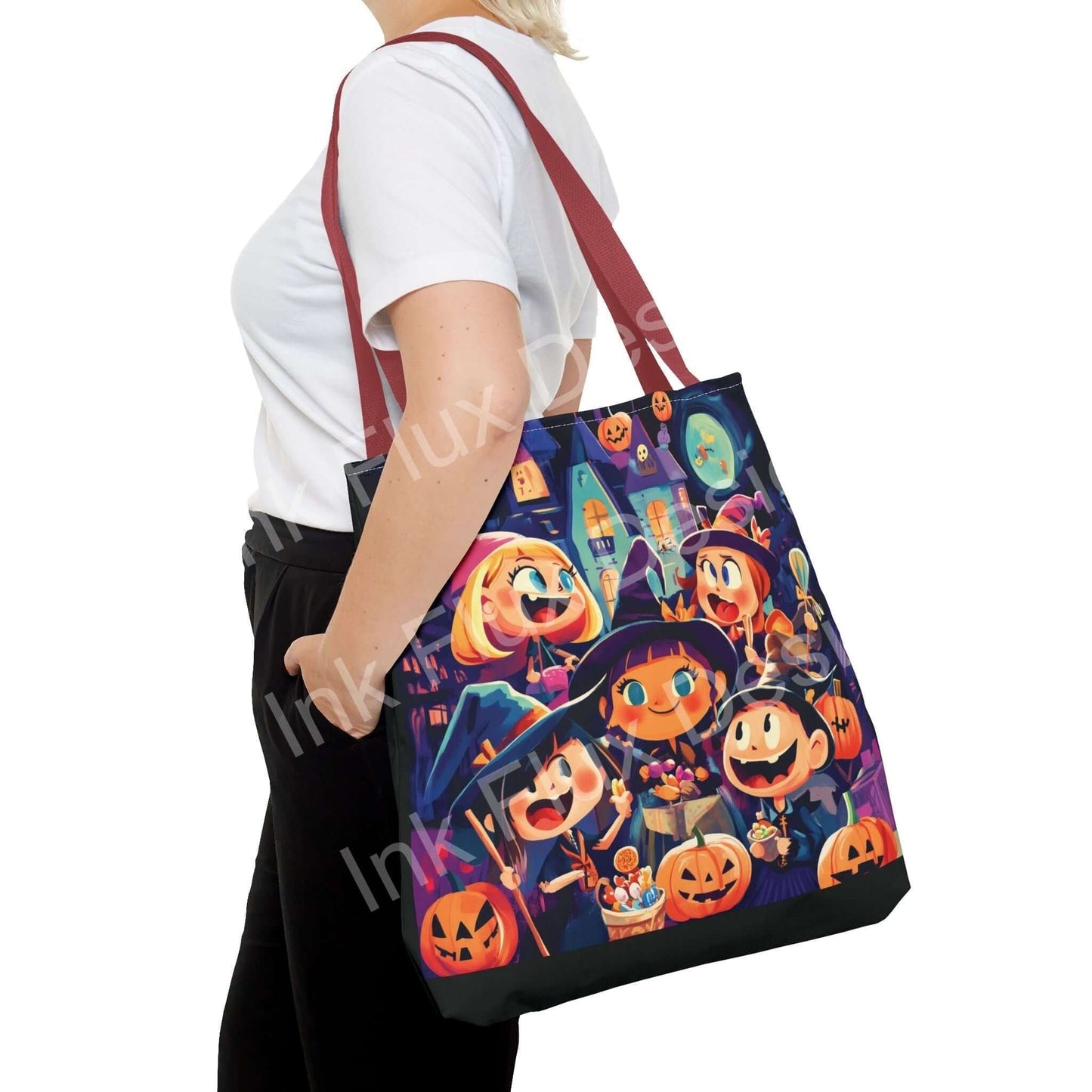 Woman carrying a Little Witches Tote Bag featuring colorful all-over print of cartoon witches and pumpkins, with red straps.