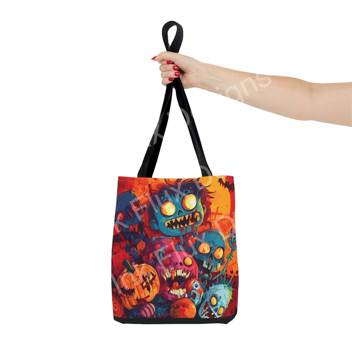 Person holding a Little Zombies tote bag featuring vibrant all-over print design, made with durable polyester and colored handles.