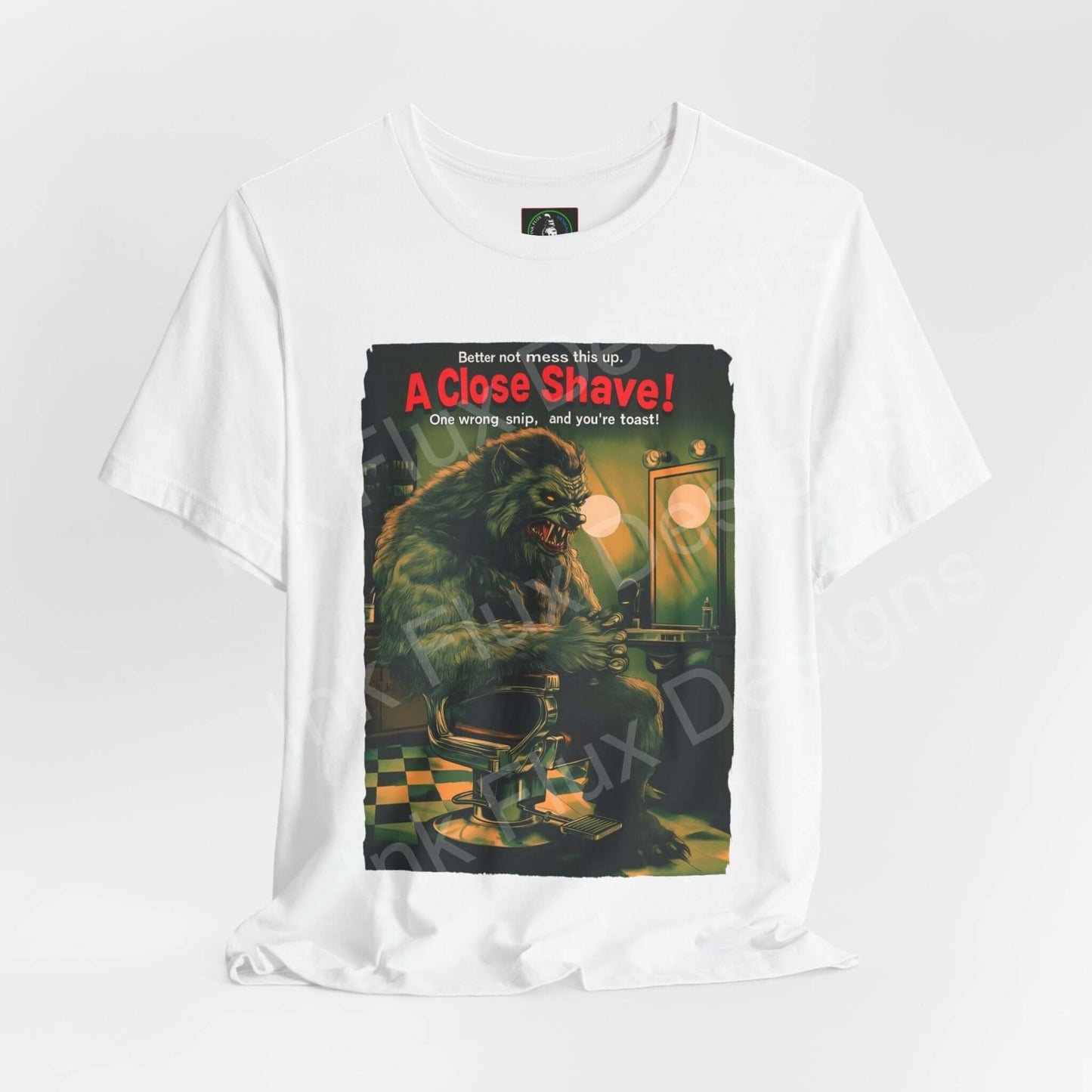 Halloween-themed graphic tee featuring 'A Close Shave!' design with a werewolf barber, crafted from breathable Airlume cotton by Bella+Canvas.