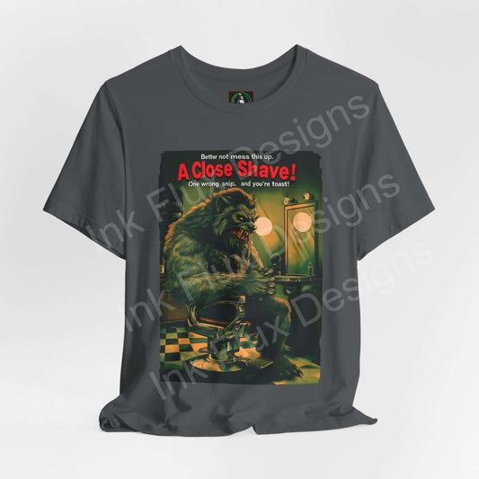 Halloween-themed graphic tee featuring a werewolf barber design titled "A Close Shave!" on a gray Bella+Canvas unisex T-shirt.