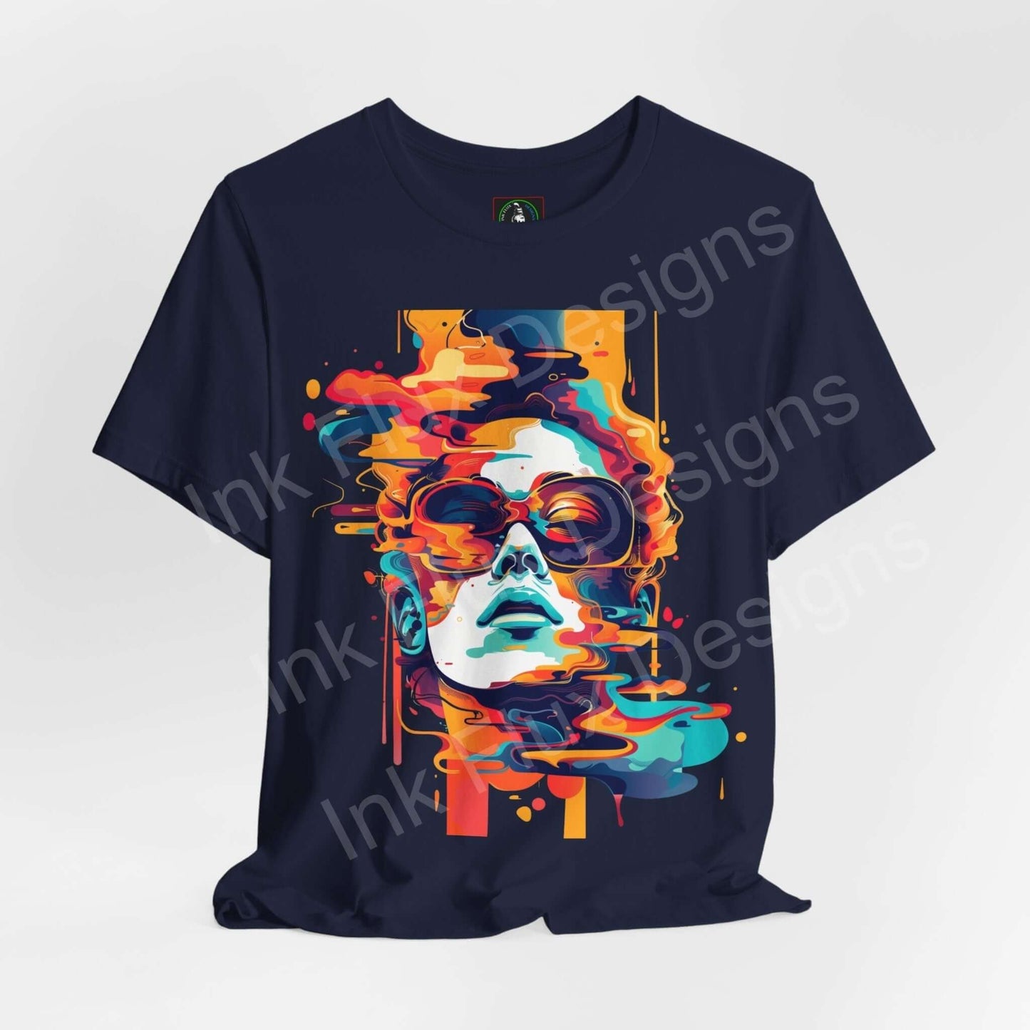 Abstract cyberpunk graphic tee featuring vivid, splattered portrait design on a dark blue Bella+Canvas T-shirt, ideal for style and comfort.