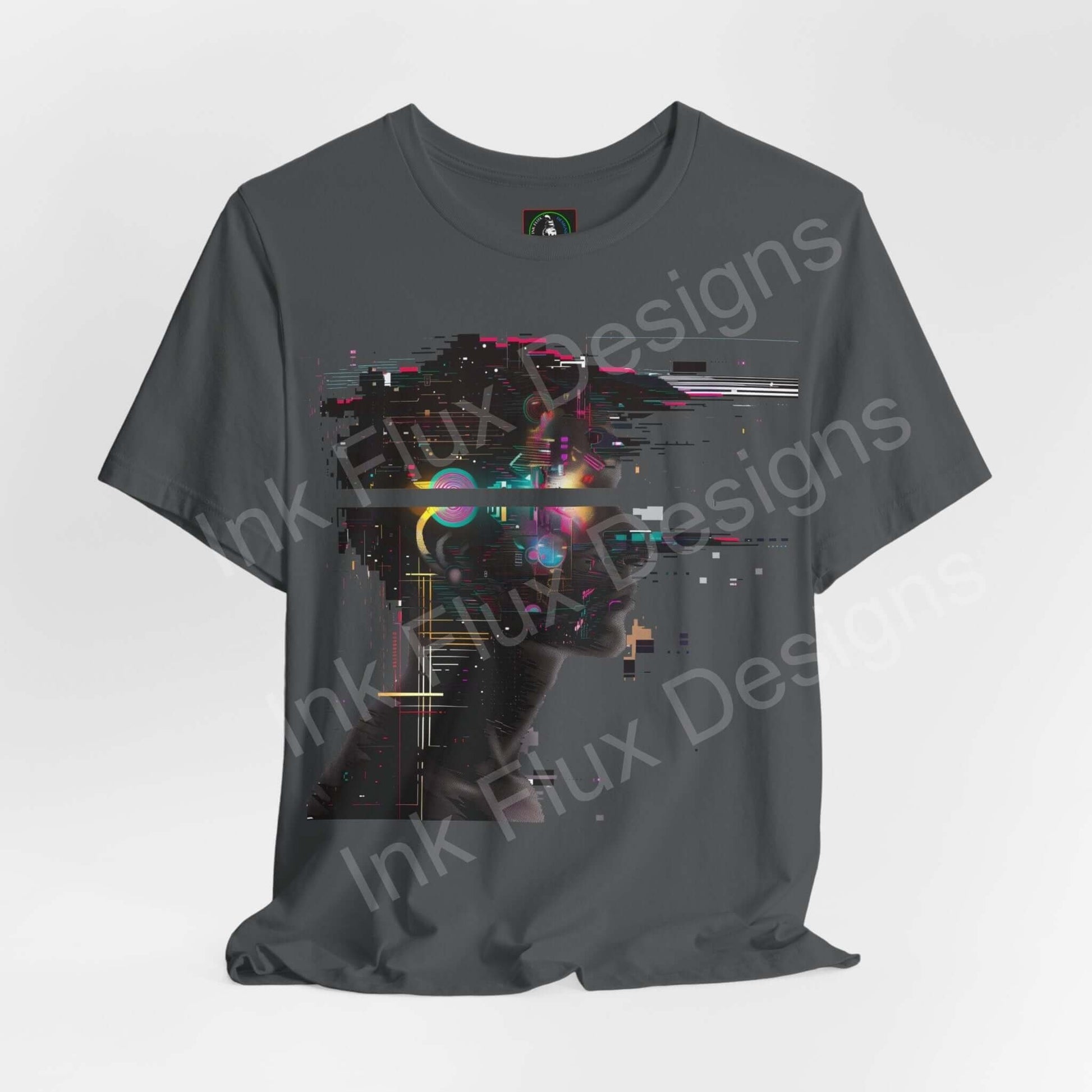 Cyberpunk-inspired graphic tee featuring an abstract portrait with vibrant digital elements on a dark gray unisex T-shirt by Bella+Canvas.