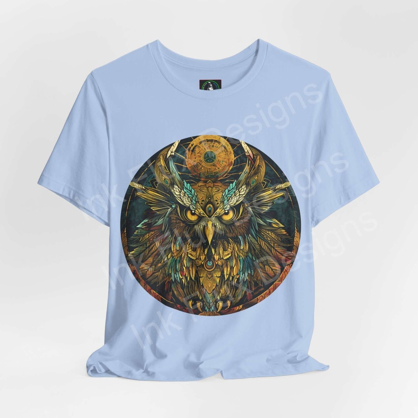 Light blue unisex T-shirt featuring a detailed graphic of an ancient owl, symbolizing spirit animals, perfect for both casual and stylish wear.
