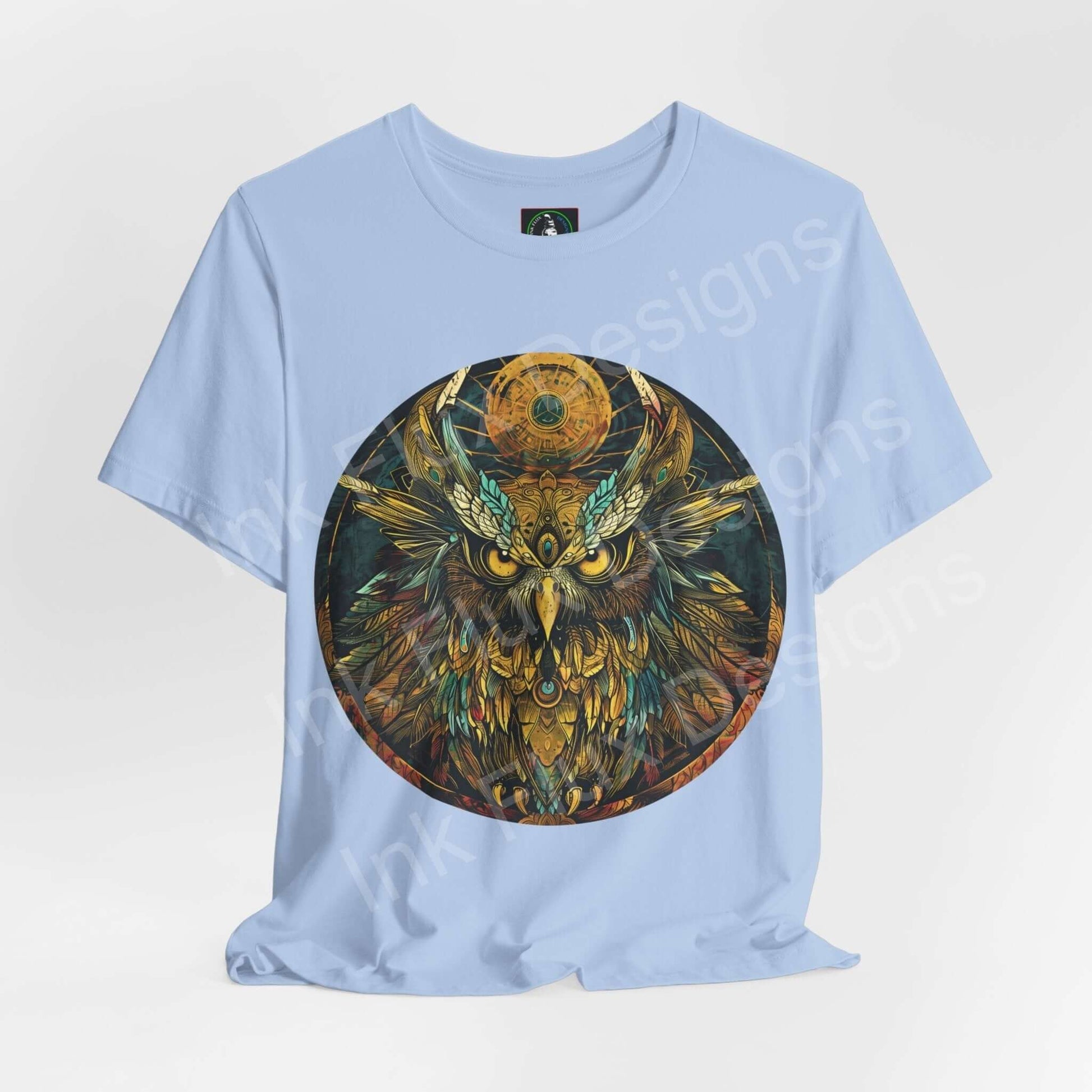 Light blue unisex T-shirt featuring a detailed graphic of an ancient owl, symbolizing spirit animals, perfect for both casual and stylish wear.