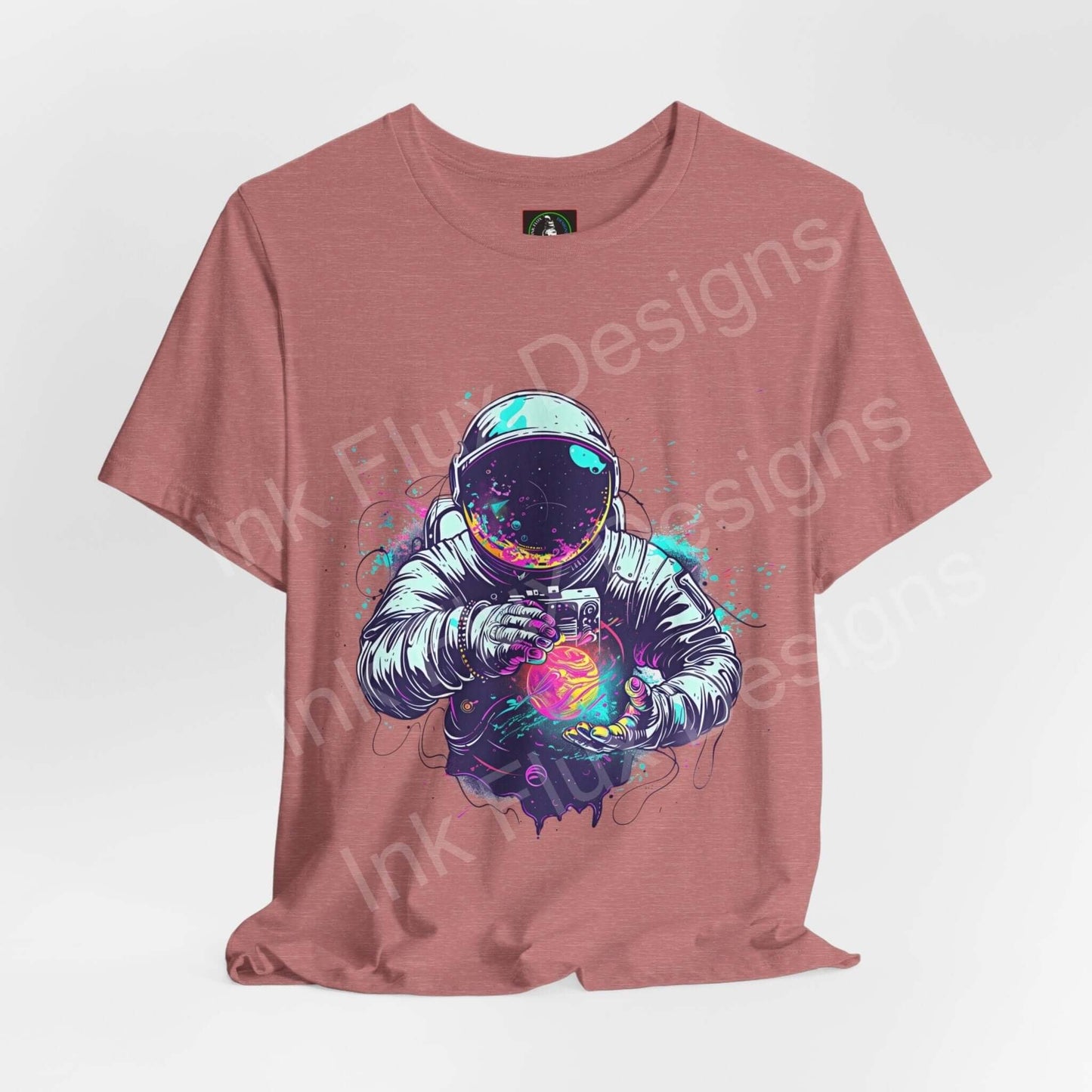Astronaut Explorer graphic tee in rose color, featuring bold cosmic print on unisex Airlume cotton T-shirt by Bella+Canvas.