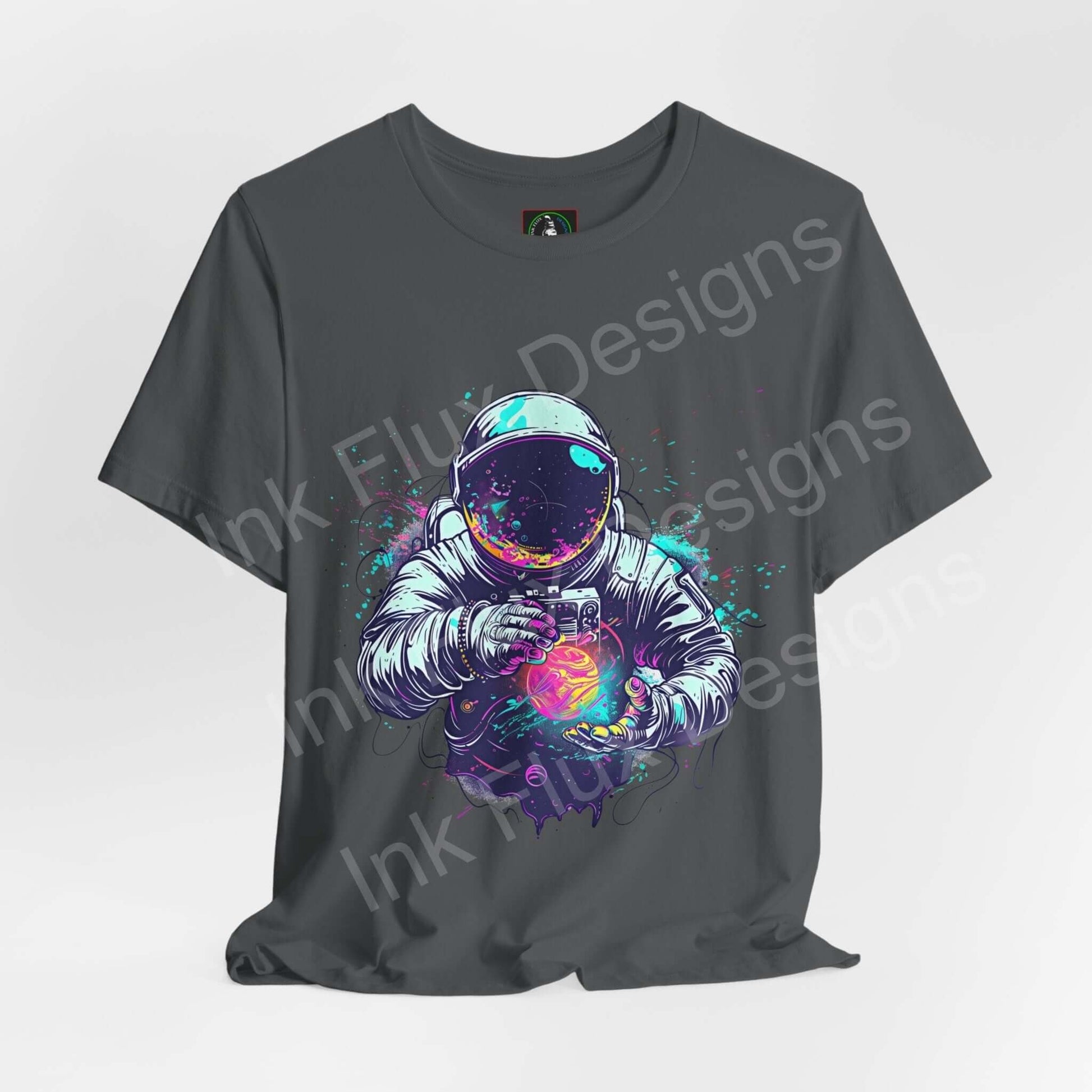 Unisex gray T-shirt featuring a bold graphic of an astronaut holding a colorful orb, crafted from breathable cotton, ideal for comfort and style.