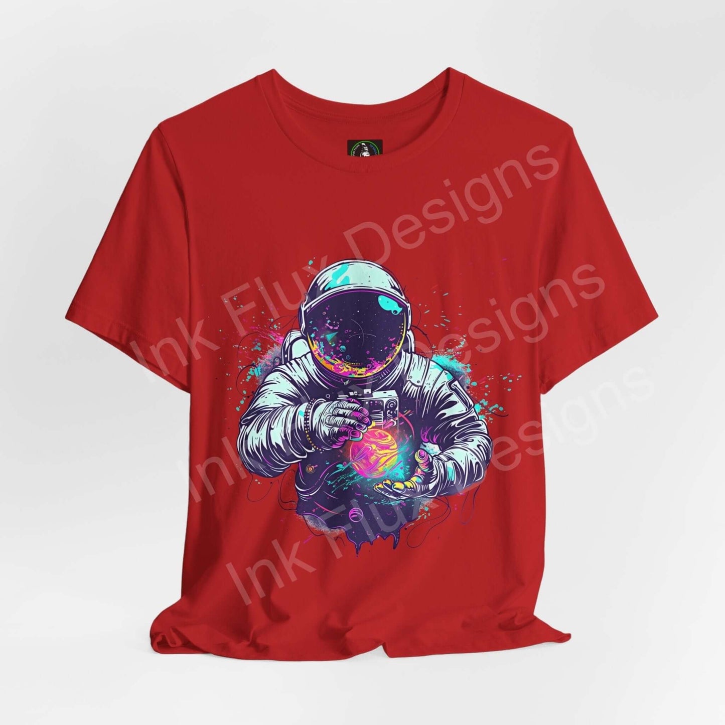 Red unisex T-shirt featuring bold graphic of an astronaut holding a vibrant, glowing orb, designed for style and comfort by Bella+Canvas.
