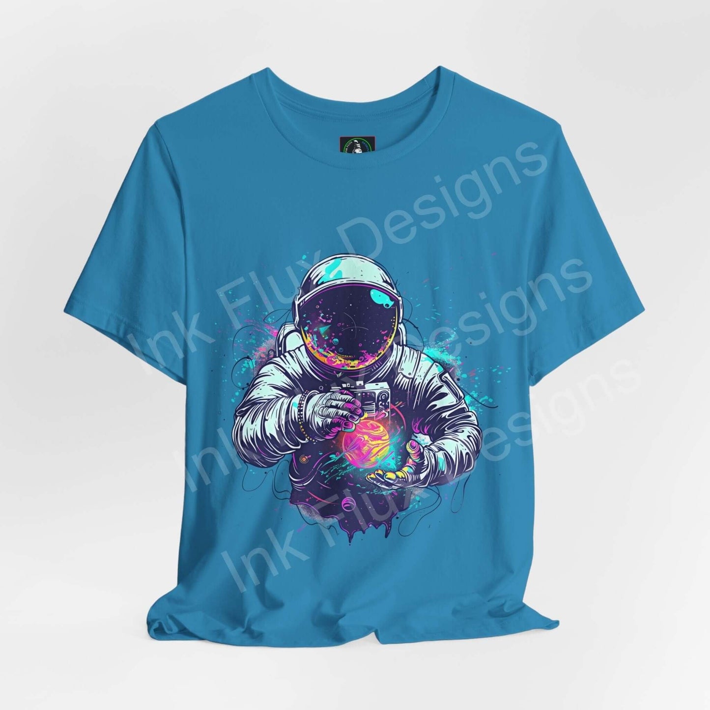 Blue unisex T-shirt featuring a bold graphic of an astronaut with colorful galaxy patterns, ideal for casual wear.