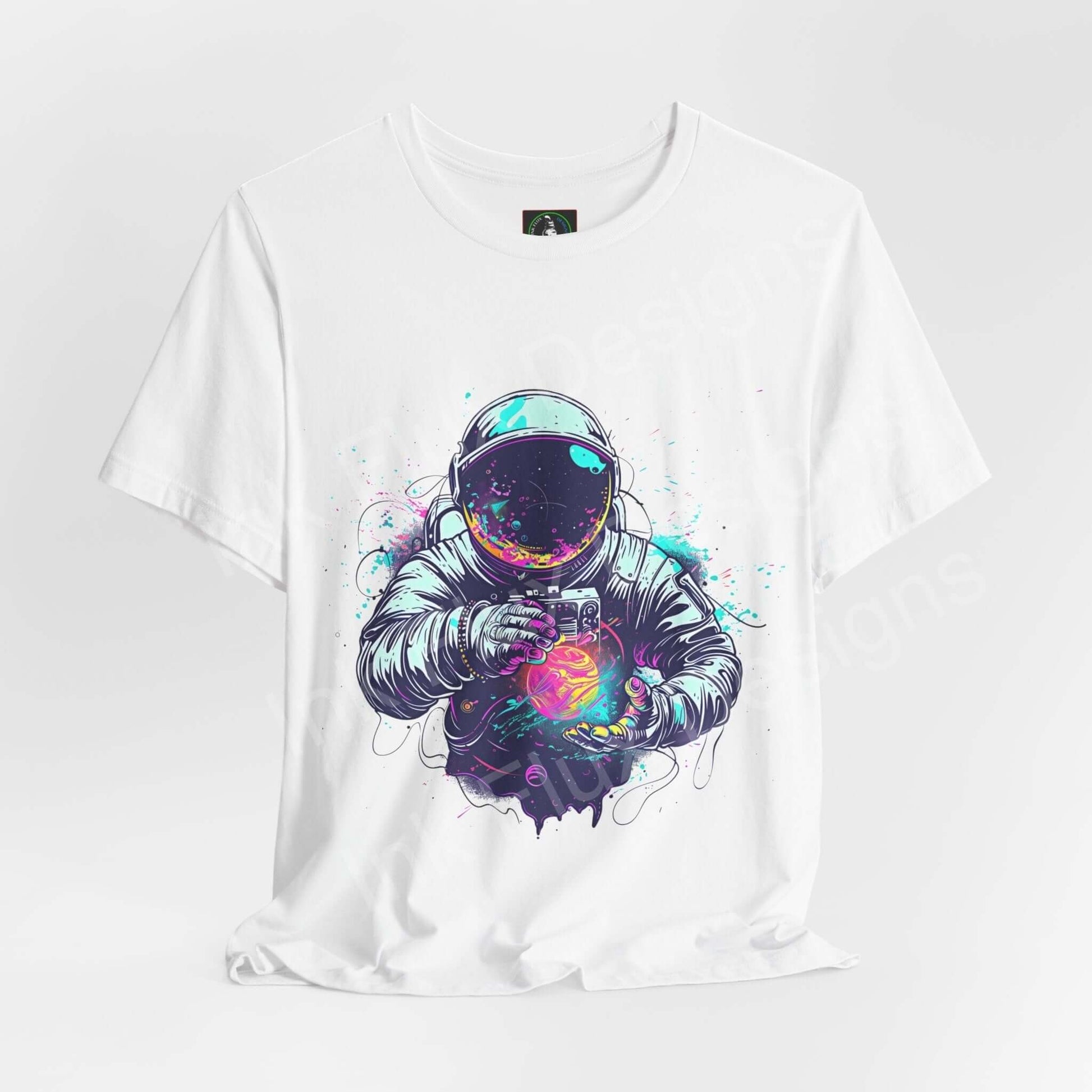 White unisex T-shirt featuring bold graphic of an astronaut holding a vibrant, colorful orb, crafted from breathable cotton, by Bella+Canvas.