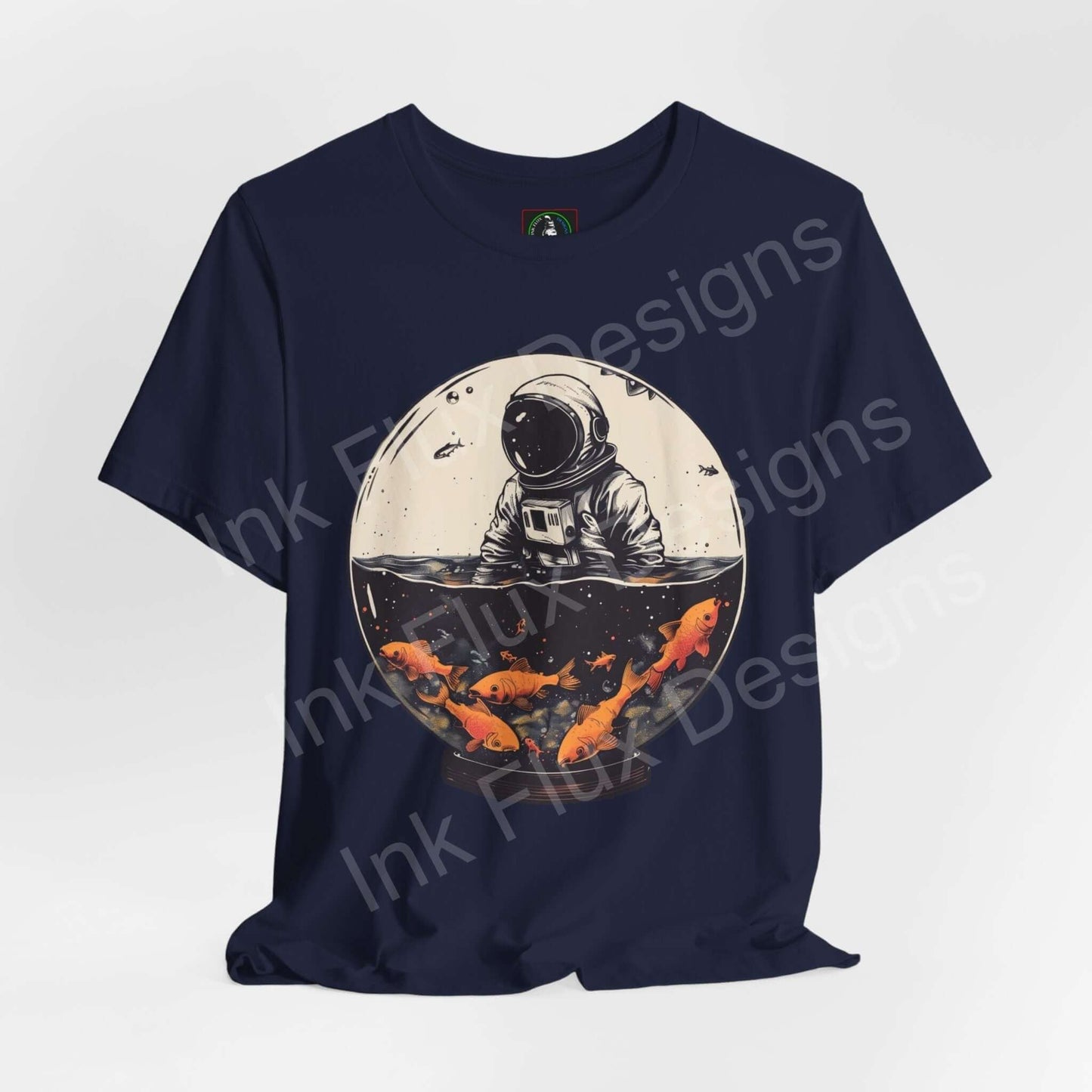 Navy blue unisex T-shirt featuring a bold graphic of an astronaut in a fish globe with vibrant orange koi, ideal for those who love unique graphic tees.