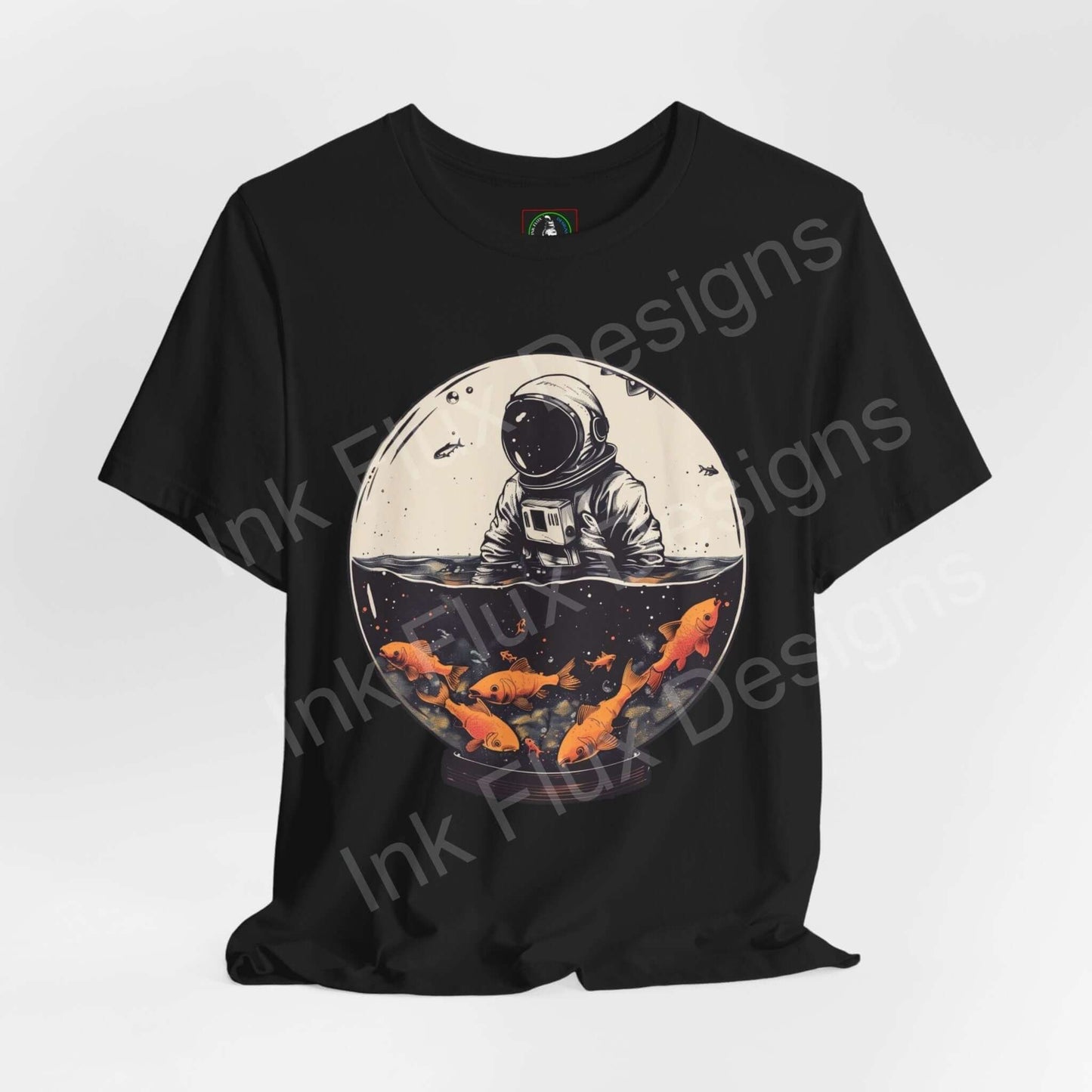 Black T-shirt featuring bold graphic of an astronaut in a fish globe, with vibrant orange koi fish, ideal for fans of unique graphic tees.
