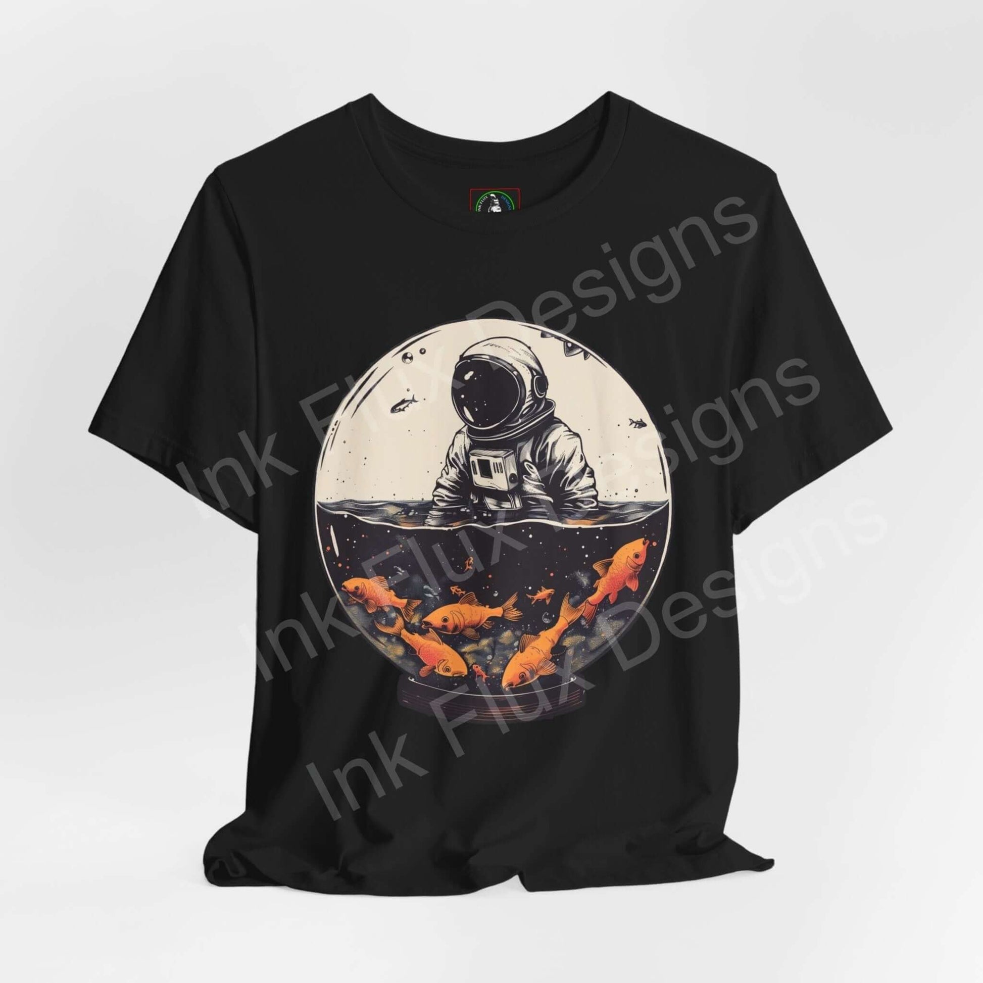 Black T-shirt featuring bold graphic of an astronaut in a fish globe, with vibrant orange koi fish, ideal for fans of unique graphic tees.