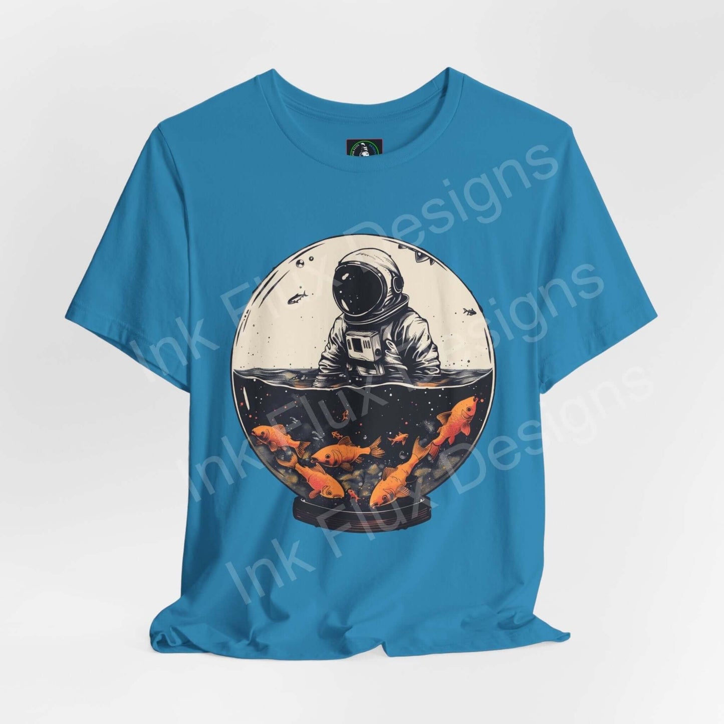 Blue unisex T-shirt featuring a bold graphic of an astronaut in a fish-filled globe on the front, designed with high-quality Airlume cotton fabric.
