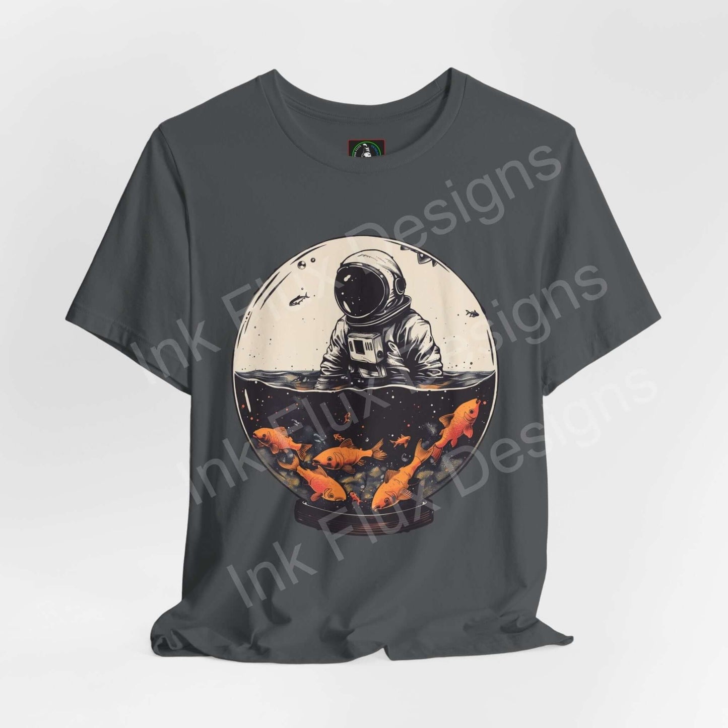 Astronaut Fish Globe graphic tee in gray, featuring a bold illustration of an astronaut with a fishbowl helmet, by Bella+Canvas.