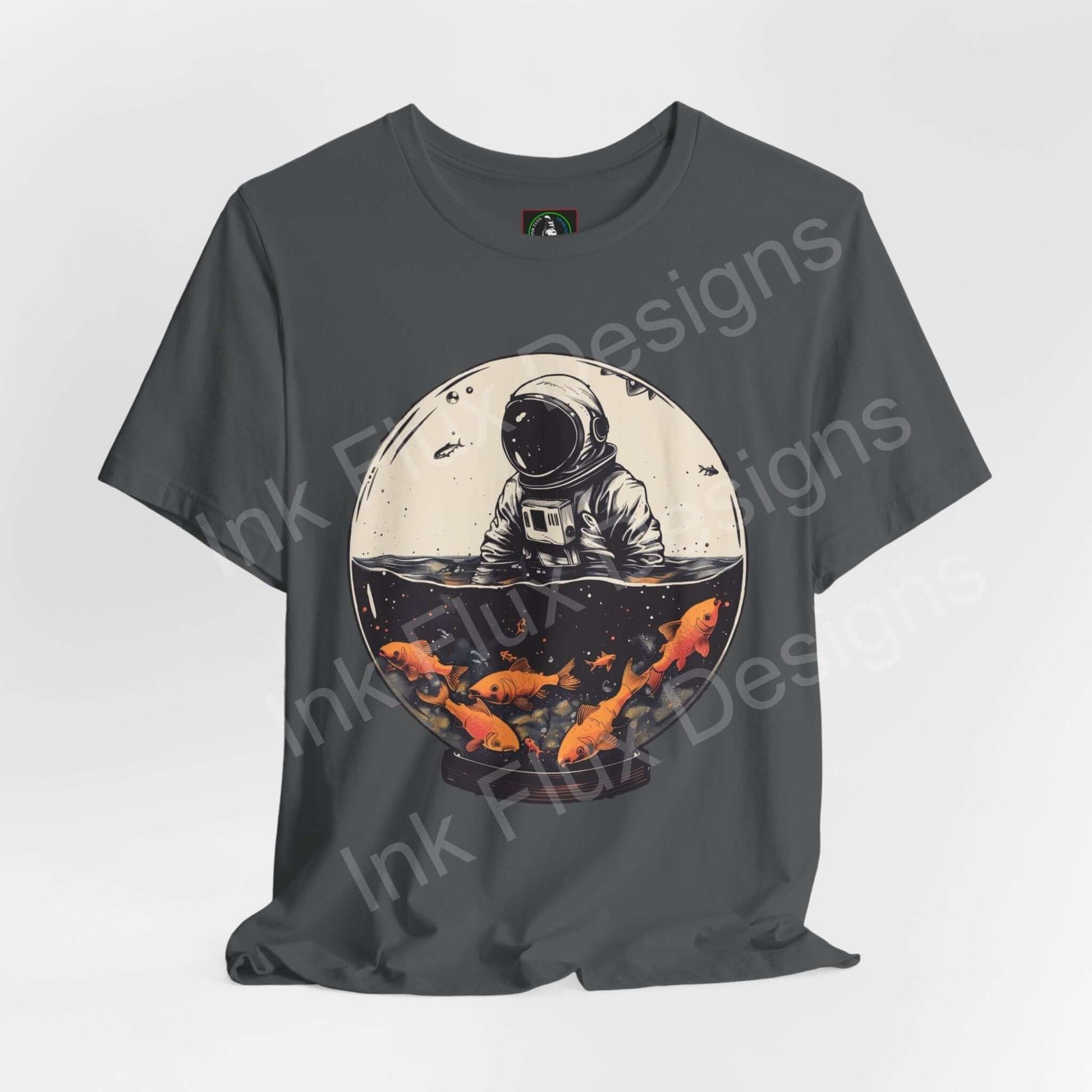 Astronaut Fish Globe graphic tee in gray, featuring a bold illustration of an astronaut with a fishbowl helmet, by Bella+Canvas.
