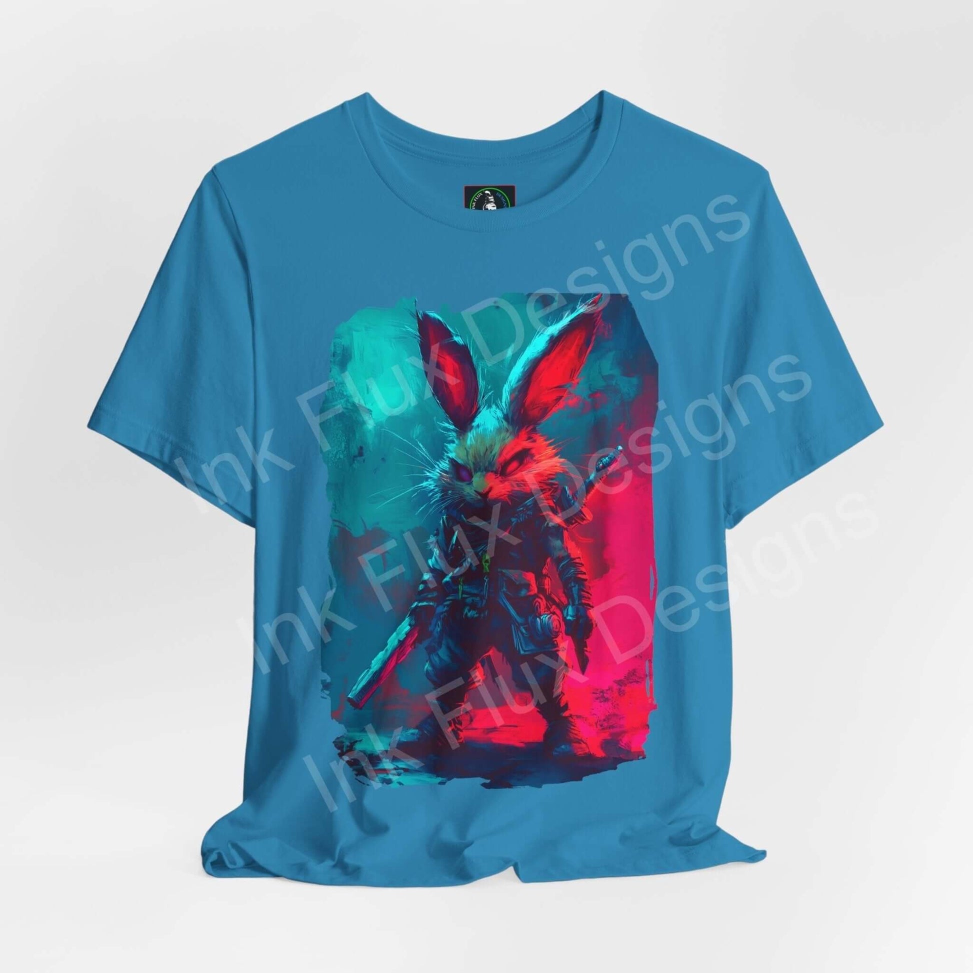 Vibrant Barbarian Rabbit graphic tee in turquoise, with bold red and blue splatter design on Airlume cotton, unisex fit