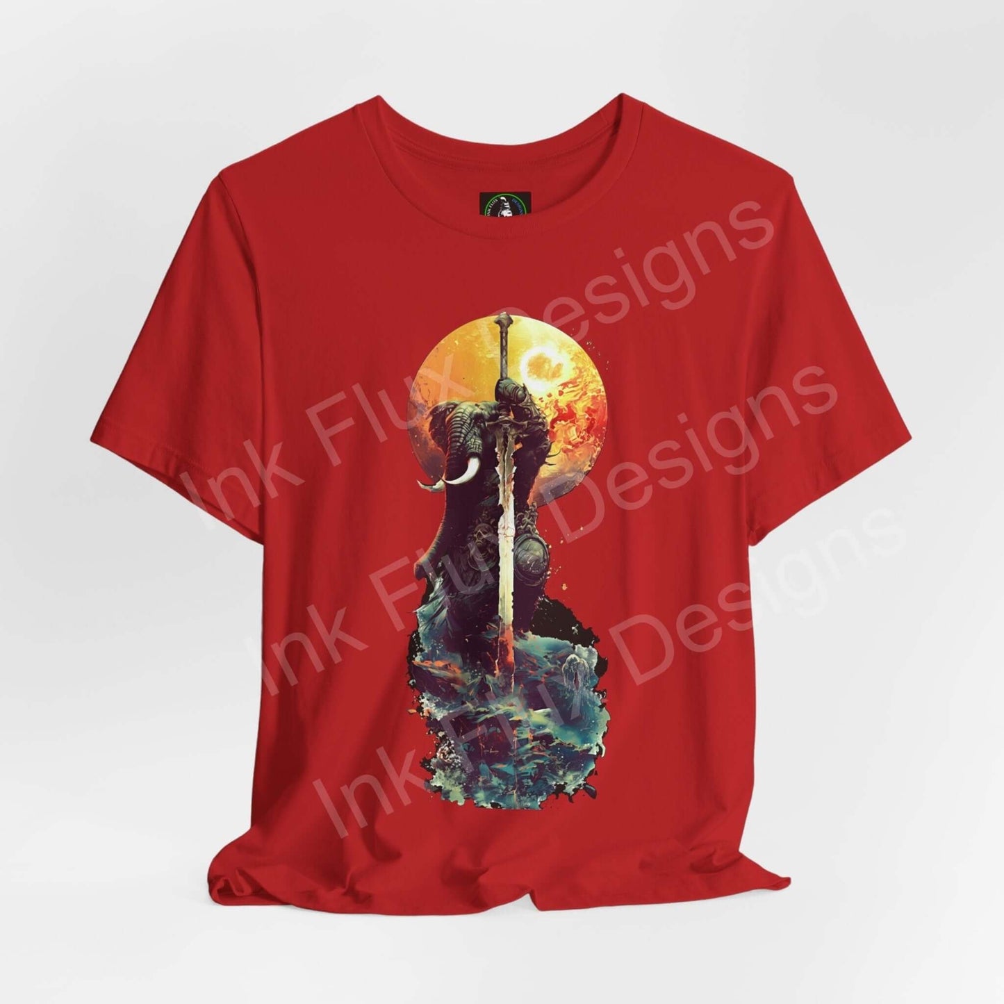 Red unisex T-shirt featuring a graphic of a battle-worn elephant warrior under a golden moon, from Bella+Canvas, emphasizing spirit animals and sustainability.