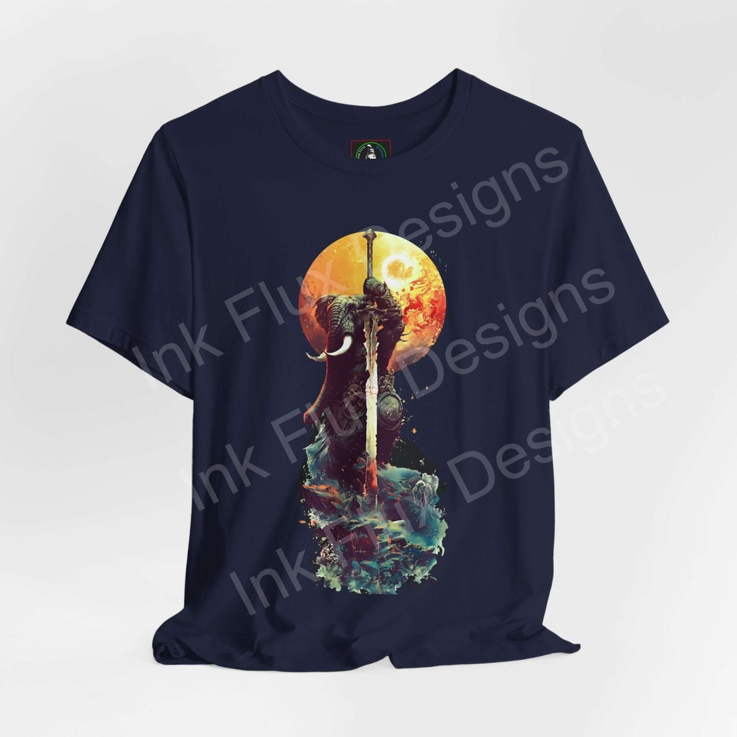 Navy blue unisex T-shirt featuring vibrant graphic of a battle-worn elephant warrior against a sunset, from Bella+Canvas, highlighting comfort and style.