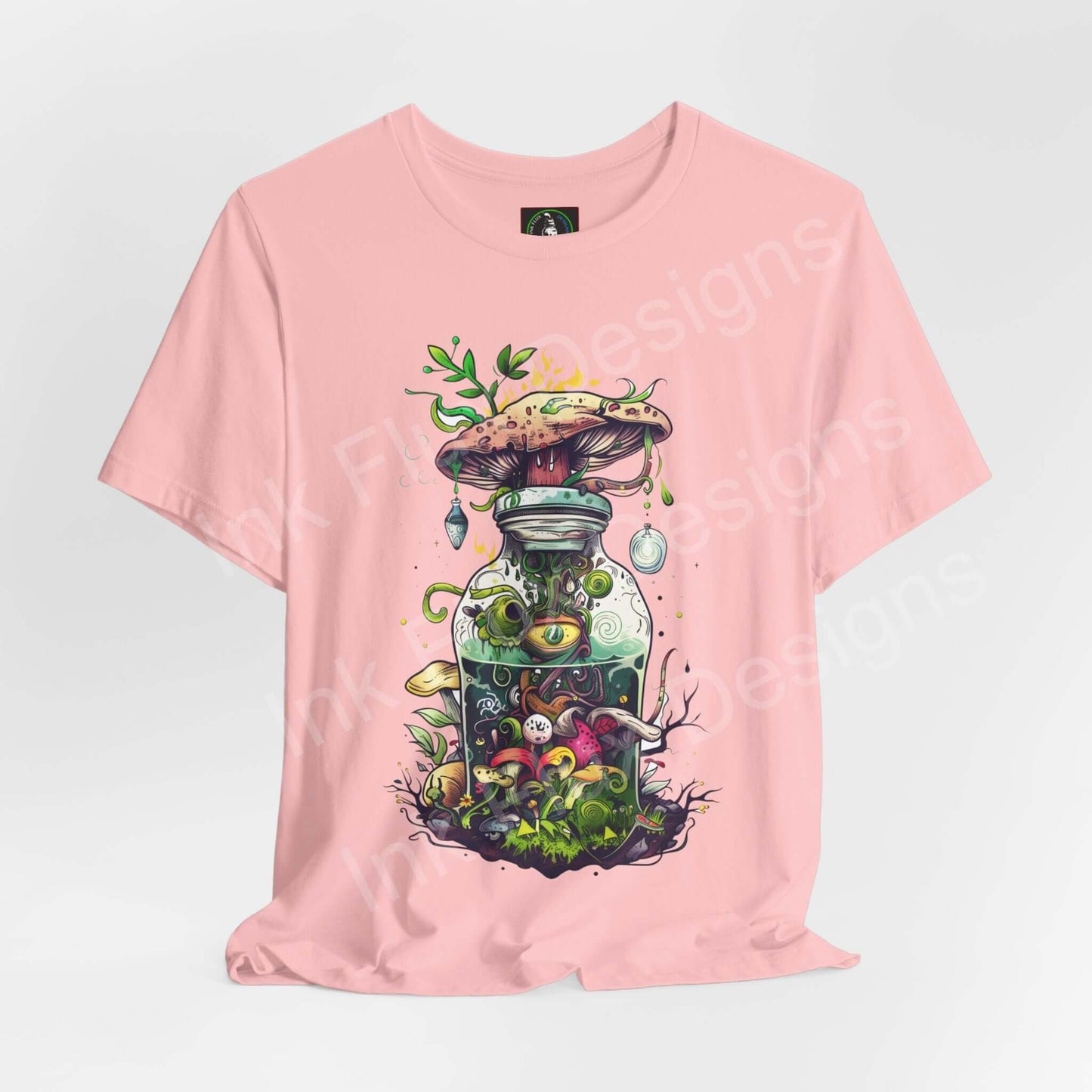 Pink unisex T-shirt featuring a bold, trippy graphic of mushrooms in a bottle, with psychedelic colors and intricate details.