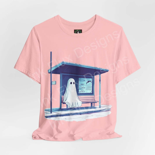 Pink unisex jersey T-shirt featuring a graphic of a ghost at a bus stop, perfect for Halloween, made by Bella+Canvas.