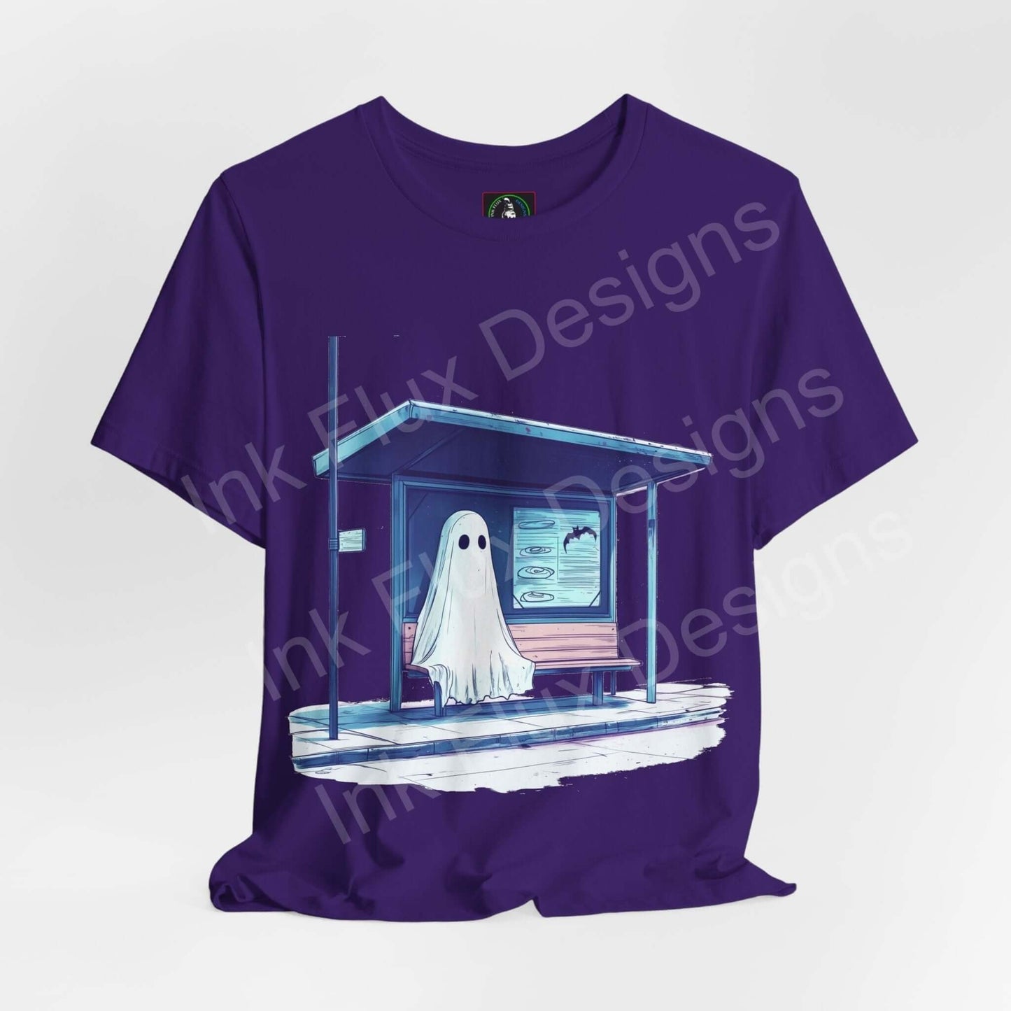Unisex purple Halloween graphic tee featuring a ghost at a bus stop design, made from soft Airlume cotton by Bella+Canvas.