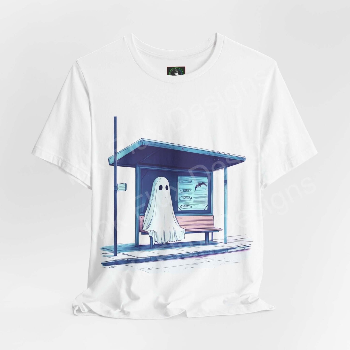 White unisex graphic tee featuring a ghost at a bus stop design, ideal for Halloween, made from sustainable Airlume cotton by Bella+Canvas.