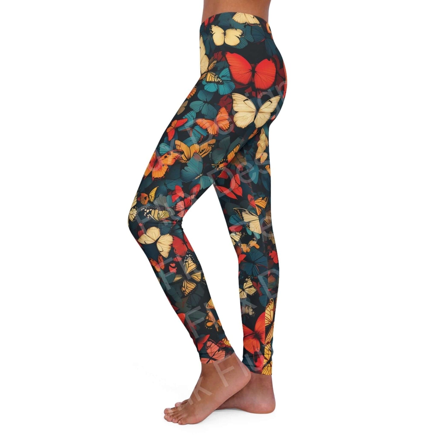 Side view of a woman wearing bold butterfly print leggings, showcasing a colorful, all-over design in a skinny fit.